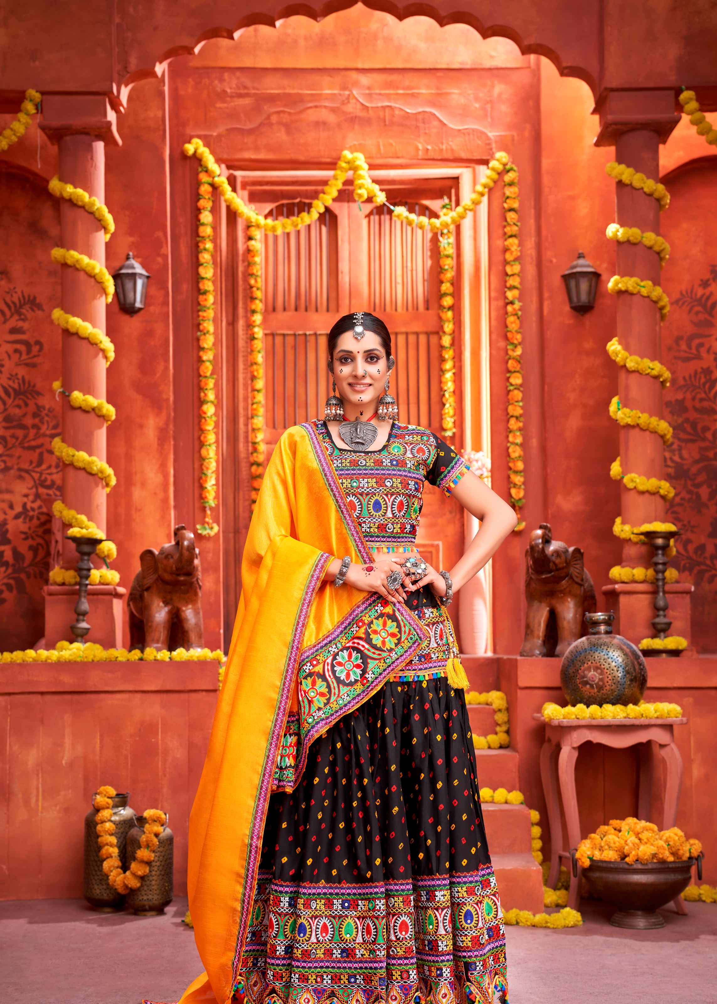 Black And Yellow Navratri Chaniya Choli With Bandhani Print With Gamthi Work And Real Mirror Work