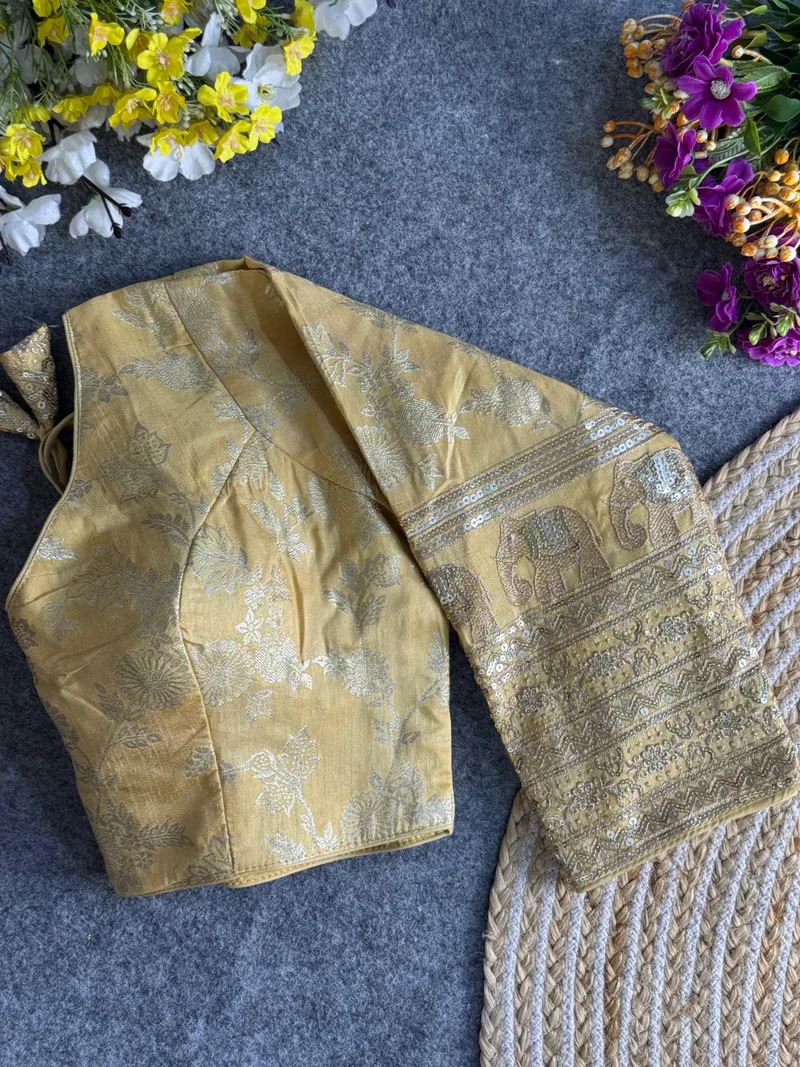 Golden Elegant Silk Blouse with Intricate Elephant Design