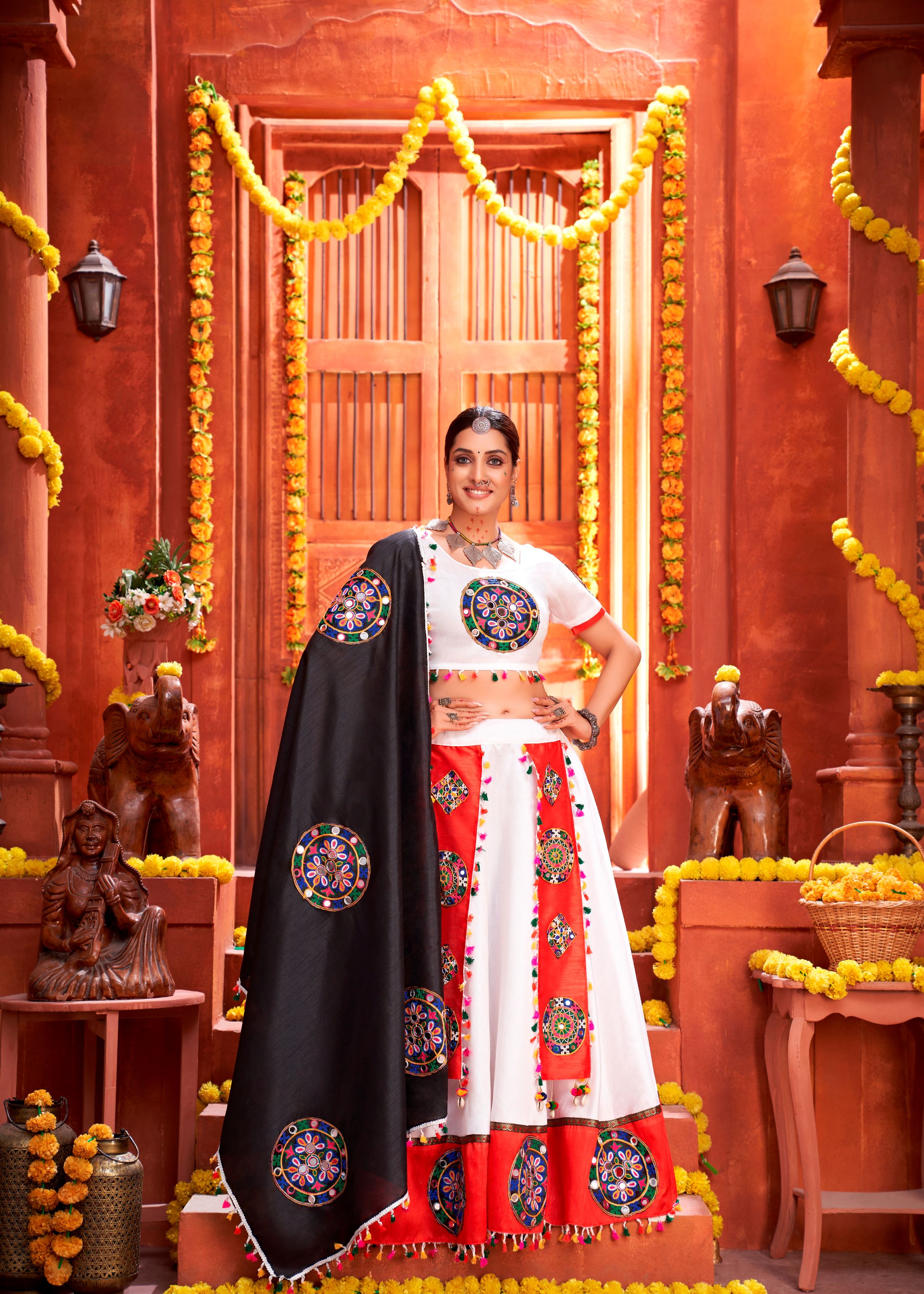 White And Orange Navratri Chaniya Choli With Gamthi Work Butta And Lace With Mirror Hand Work