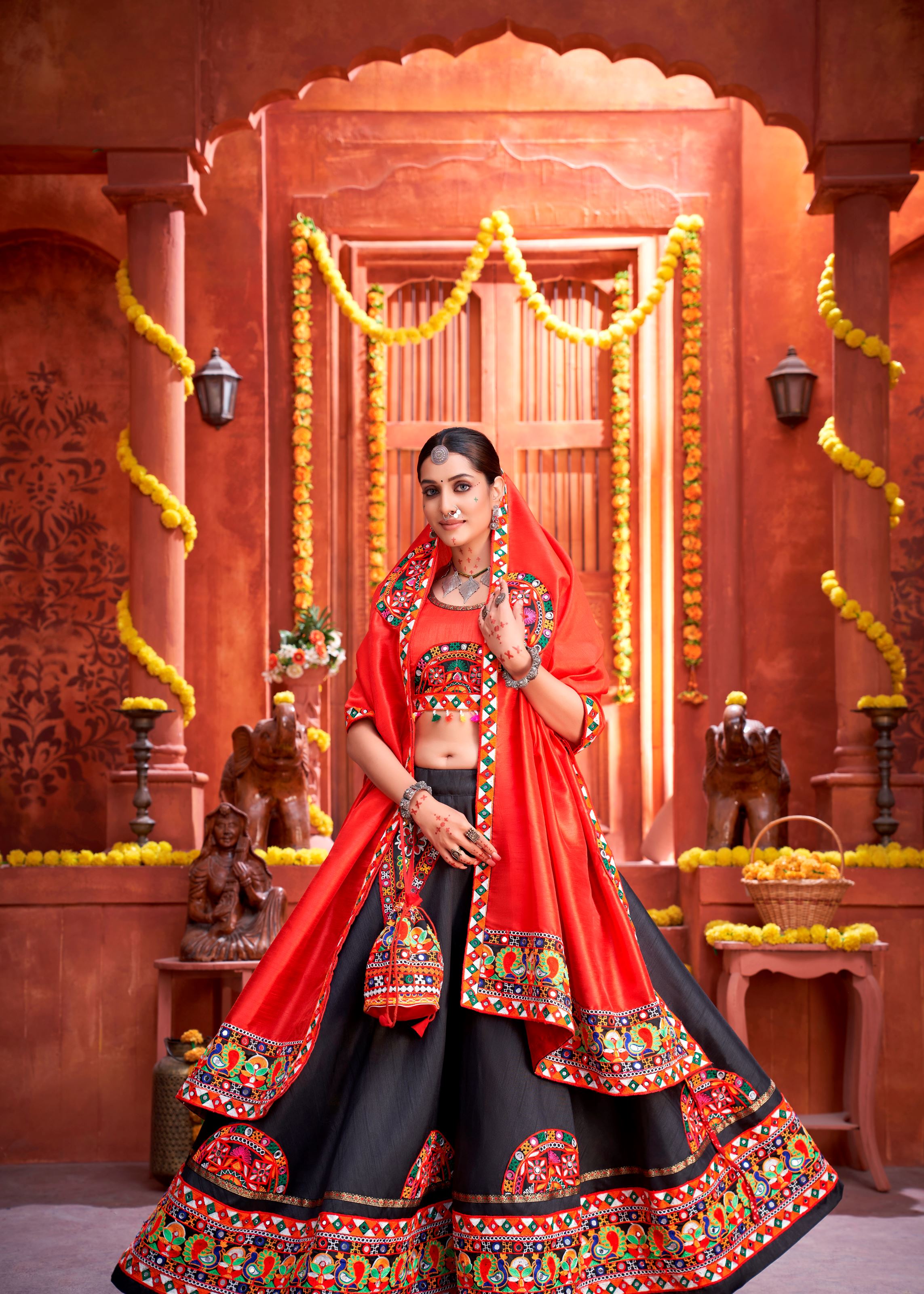 Black And Orange Navratri Chaniya Choli With Gamthi Work Butta And Lace With Mirror Hand Work