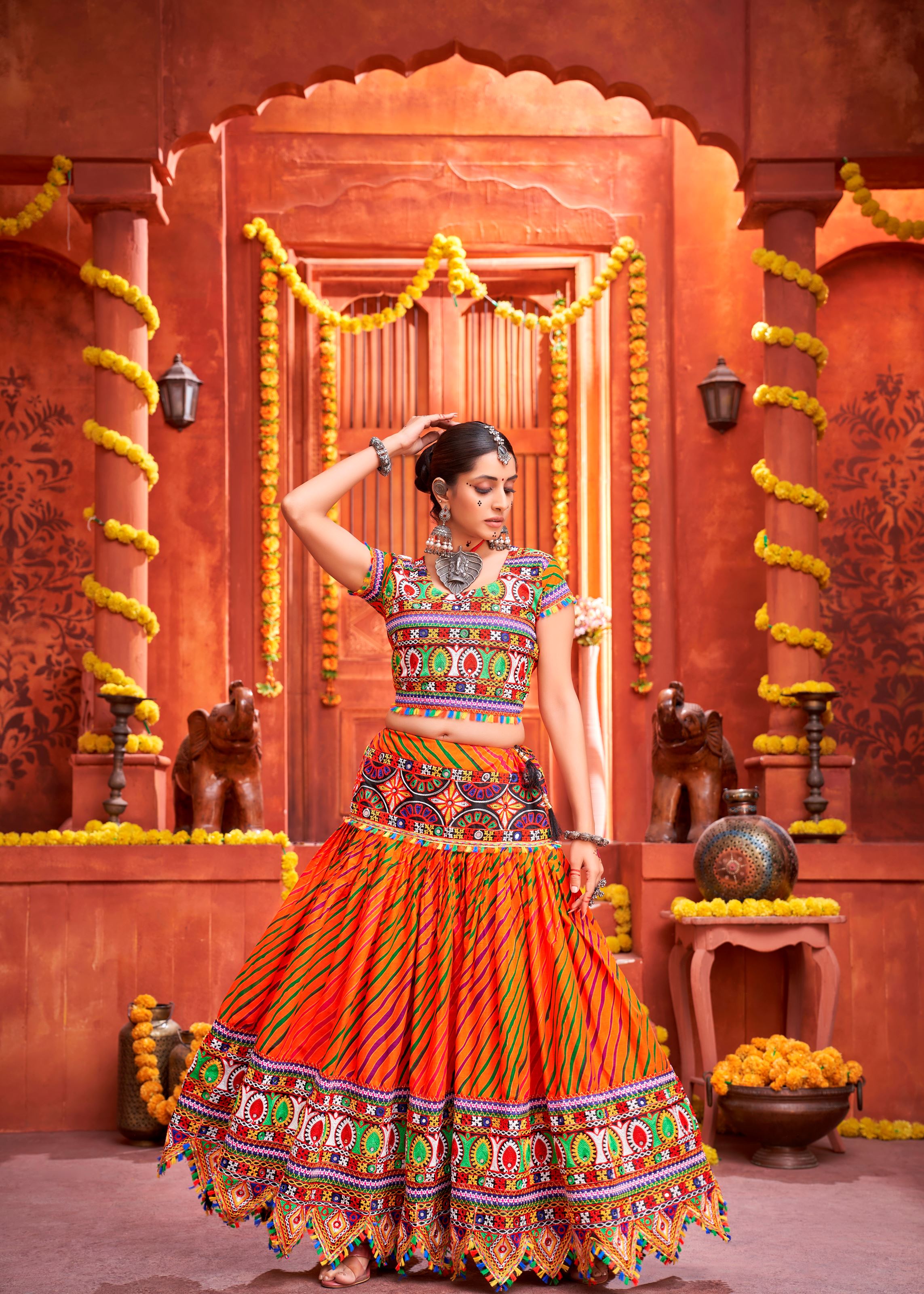 Orange And Royal Blue Navratri Chaniya Choli With Laheriya Print With Gamthi Work And Real Mirror Work