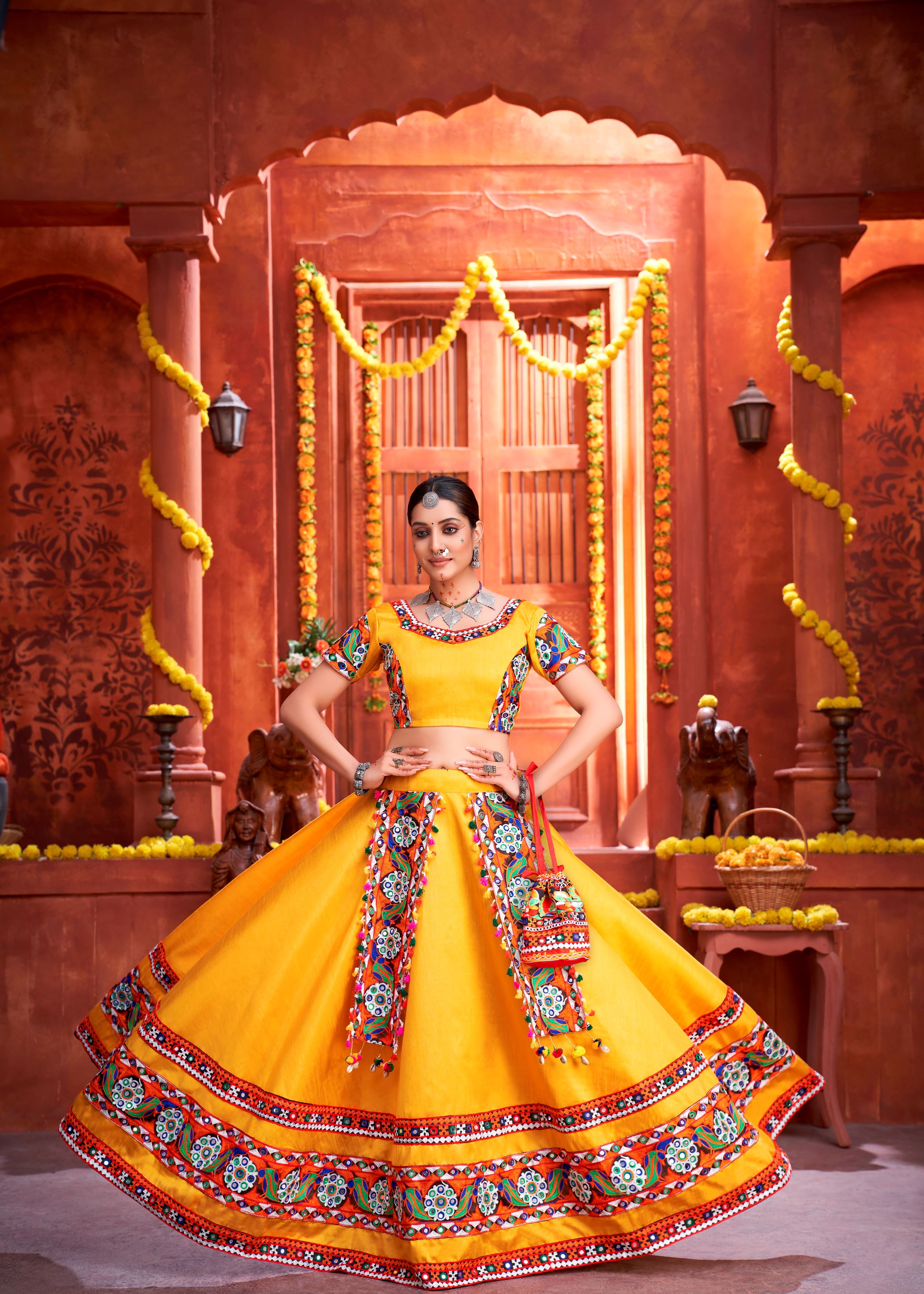 Yellow And Royal Blue Navratri Chaniya Choli With Gamthi Work Butta And Lace With Mirror Hand Work