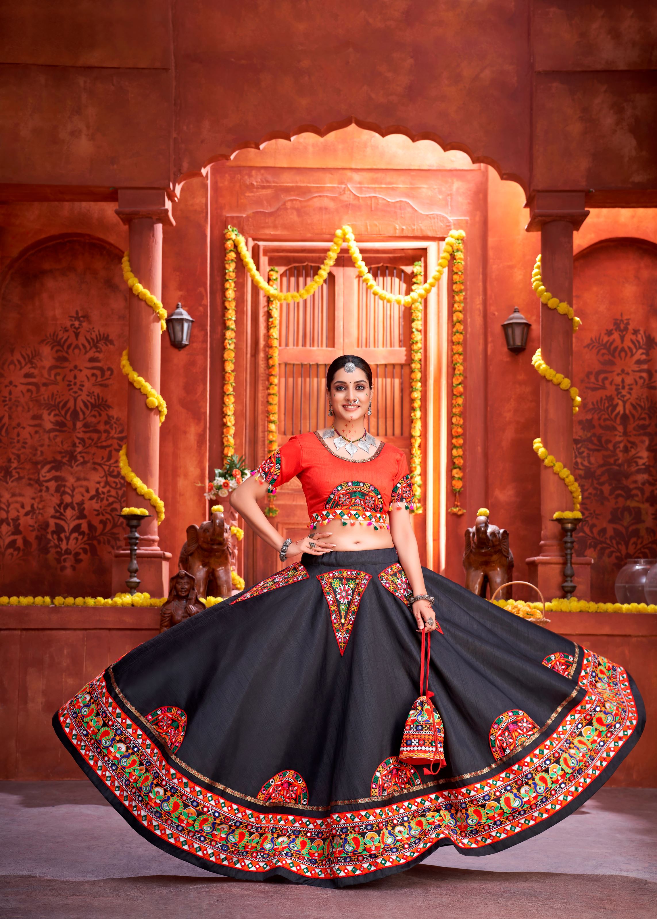 Black And Orange Navratri Chaniya Choli With Gamthi Work Butta And Lace With Mirror Hand Work