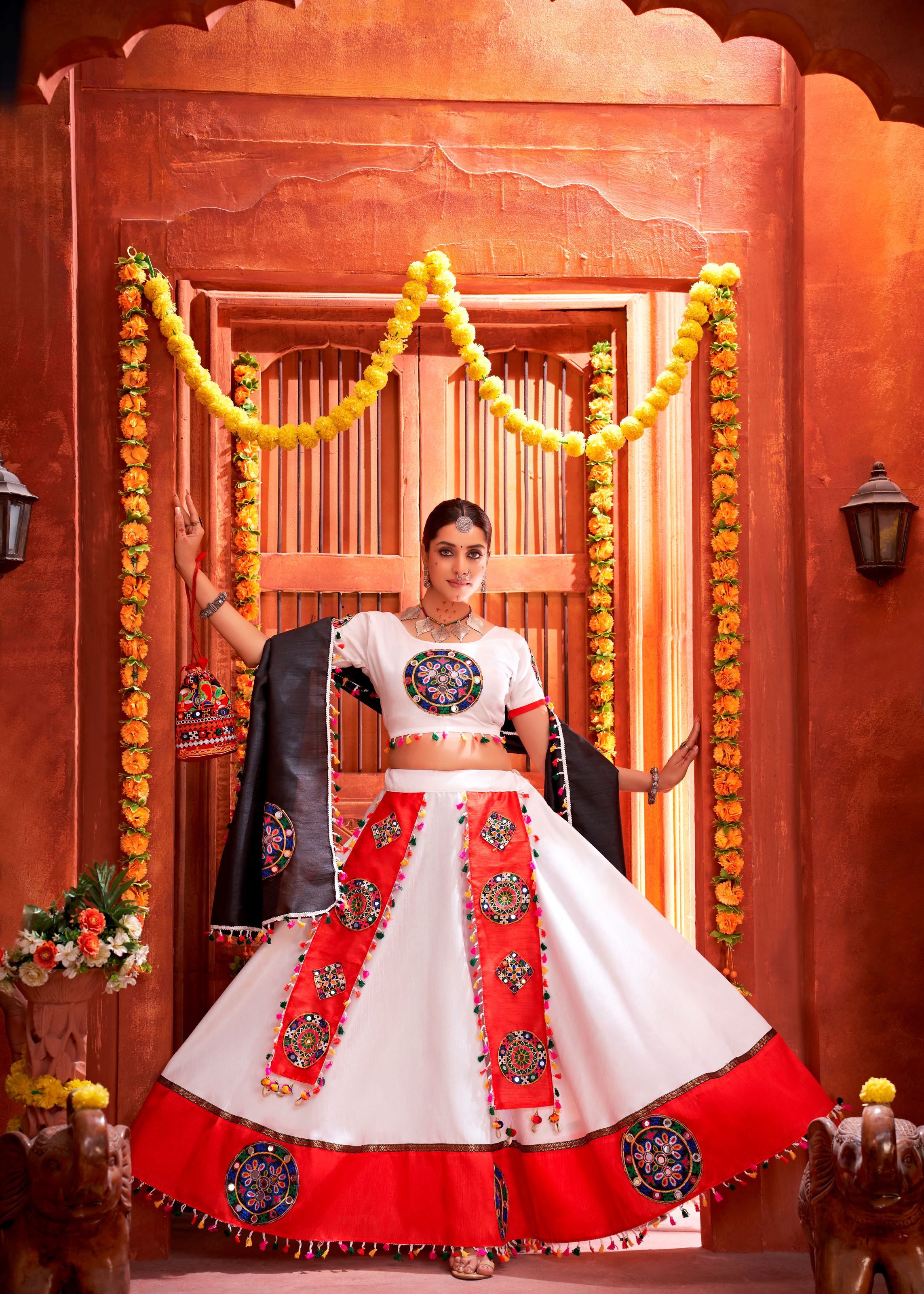 White And Orange Navratri Chaniya Choli With Gamthi Work Butta And Lace With Mirror Hand Work