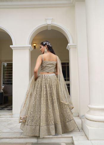 Ivory Butterfly Net Lehenga Choli With Designer Thread Work, Zari Work And Sequence Work Embroidery