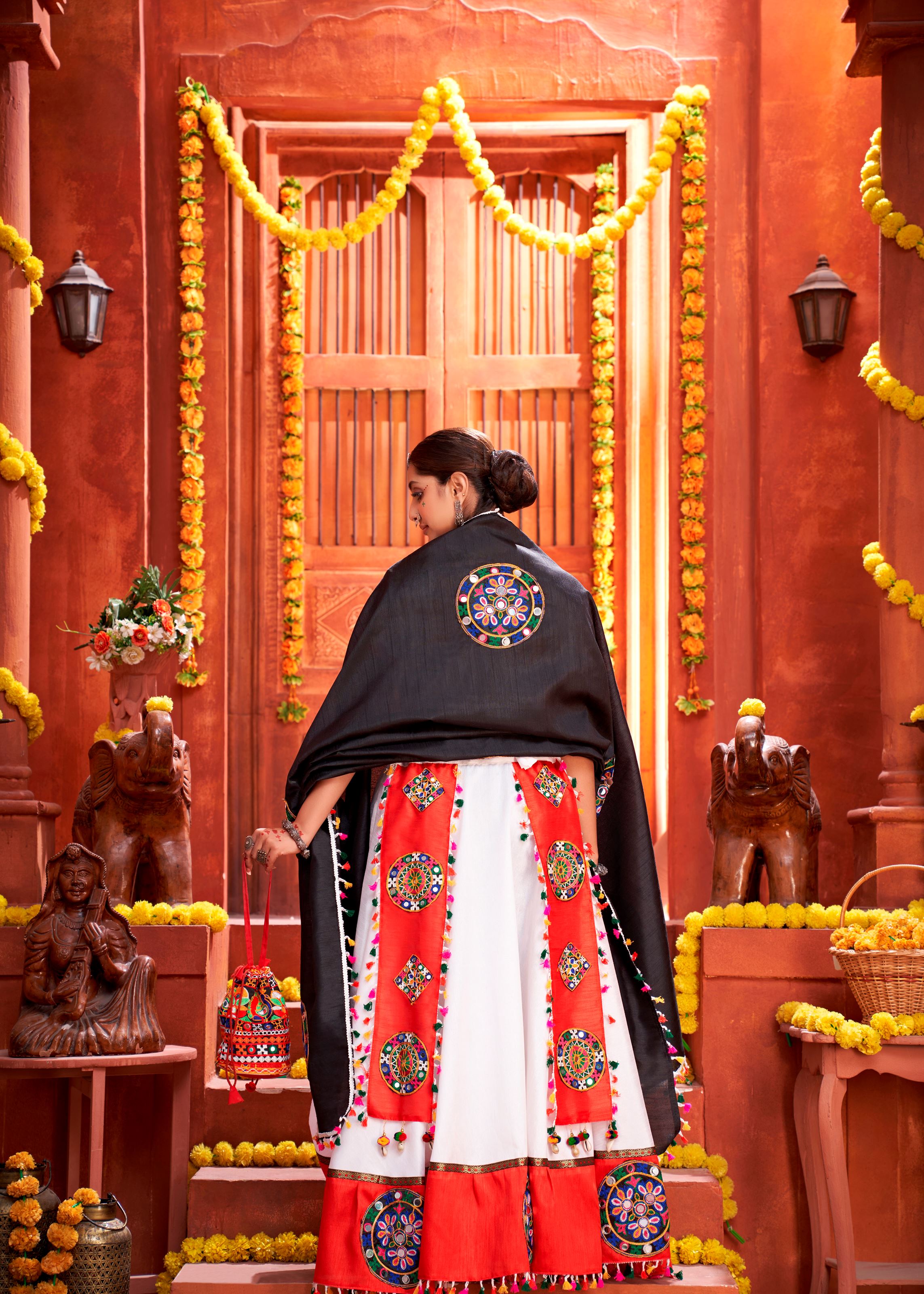 White And Orange Navratri Chaniya Choli With Gamthi Work Butta And Lace With Mirror Hand Work