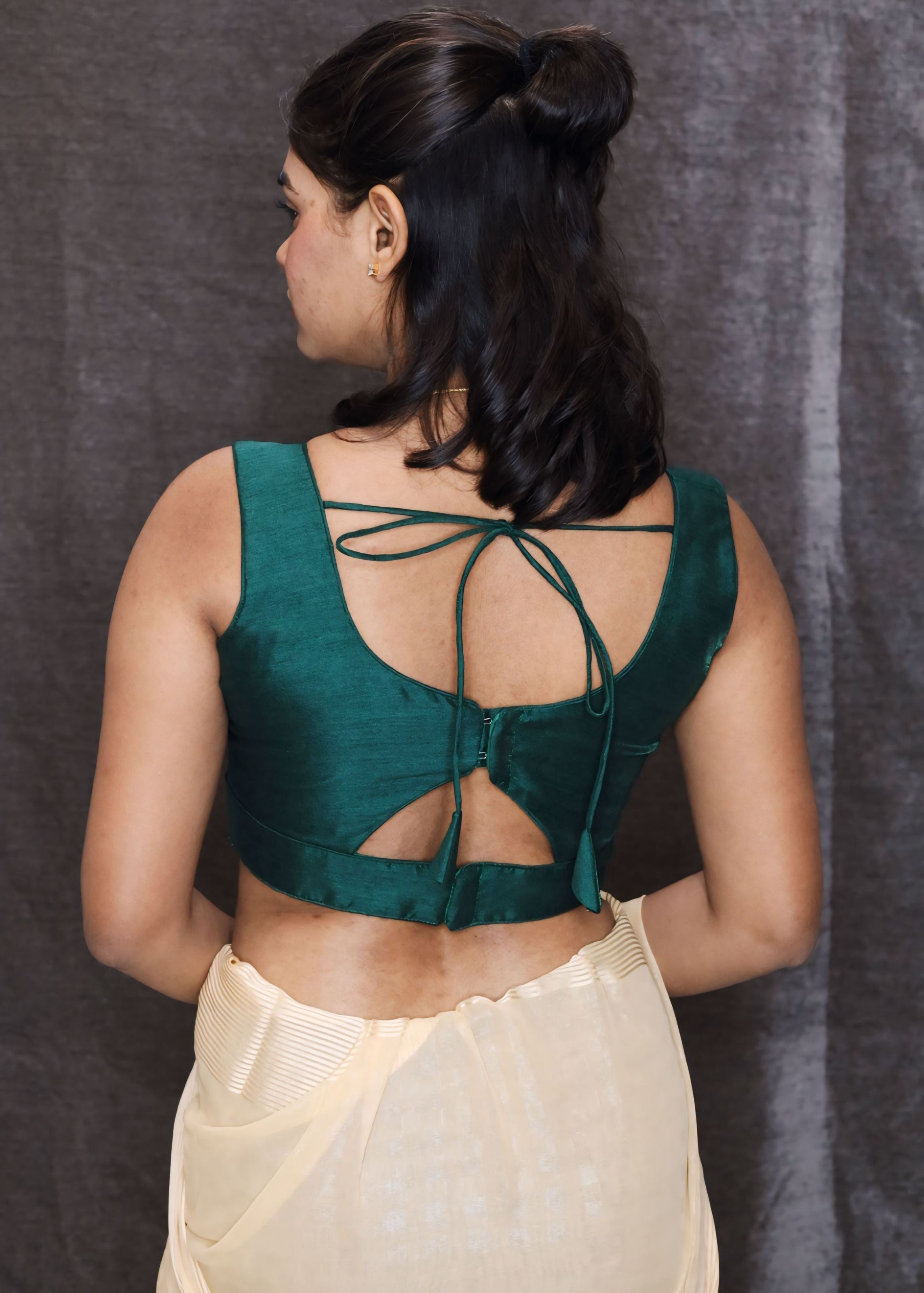 Bottle Green Sleeveless Blouse With A Triangle Cut Out At The Bottom and Back