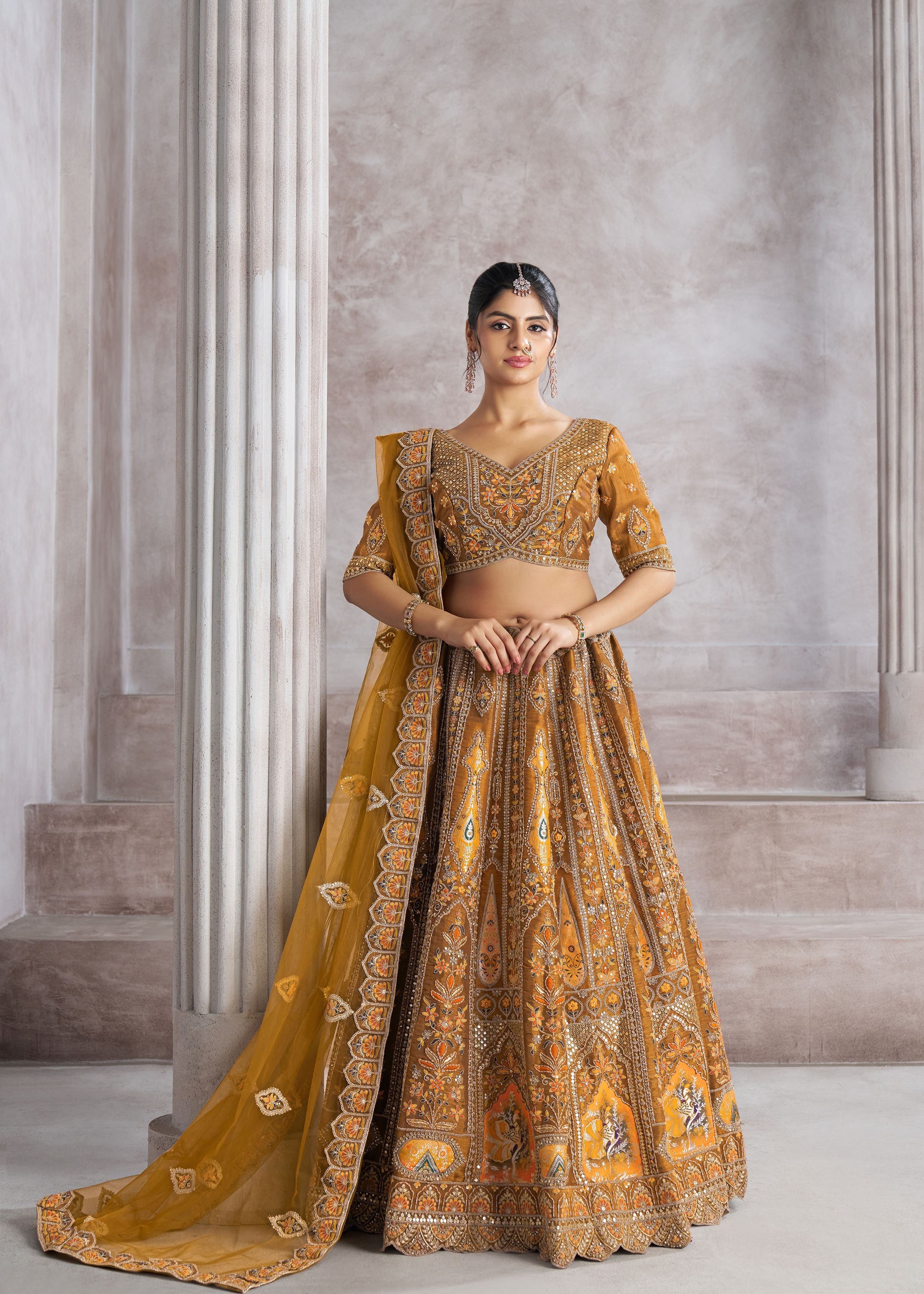 Earthy Mustard Color Bridal Lehenga With Patch And Aari Work