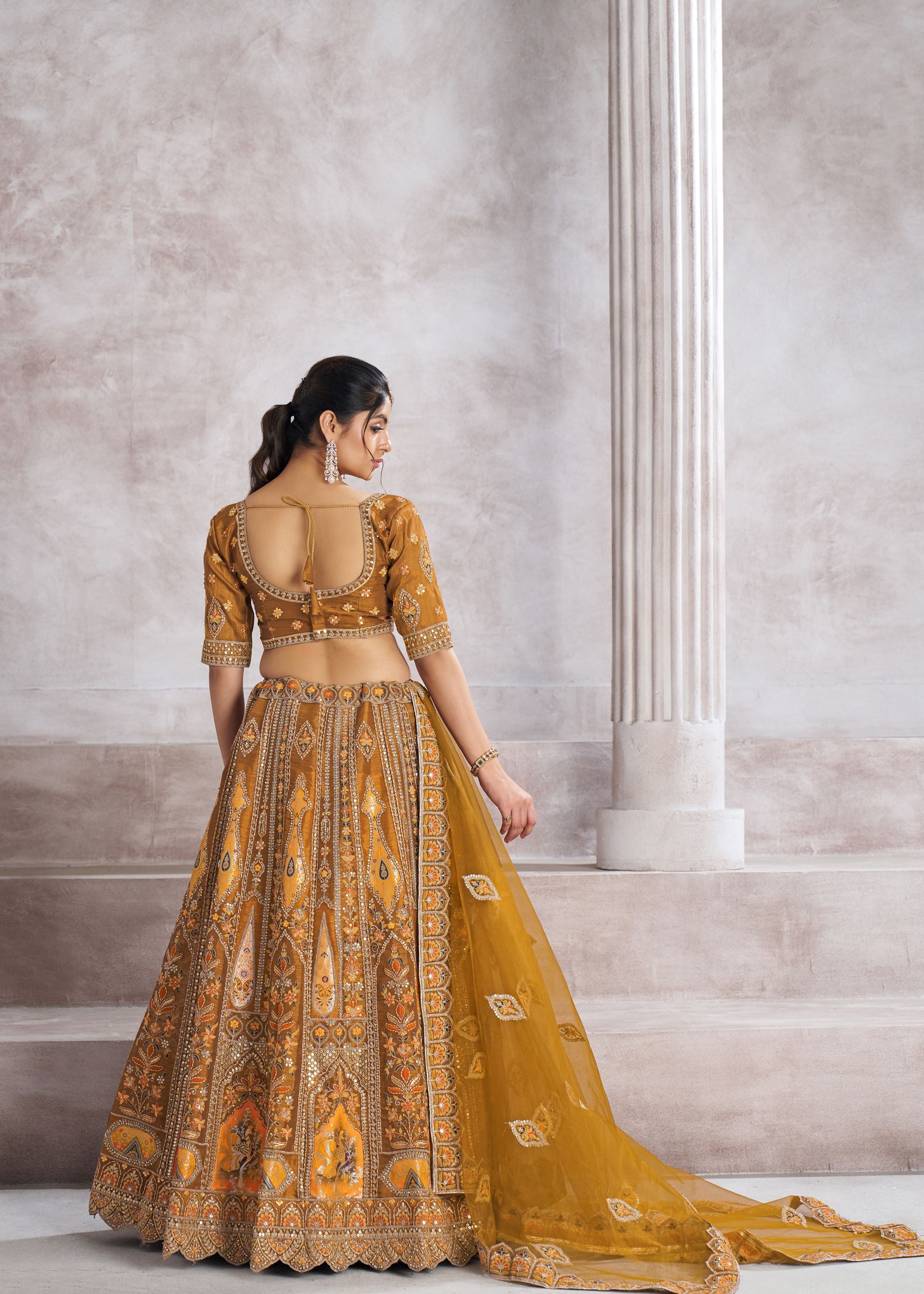 Earthy Mustard Color Bridal Lehenga With Patch And Aari Work
