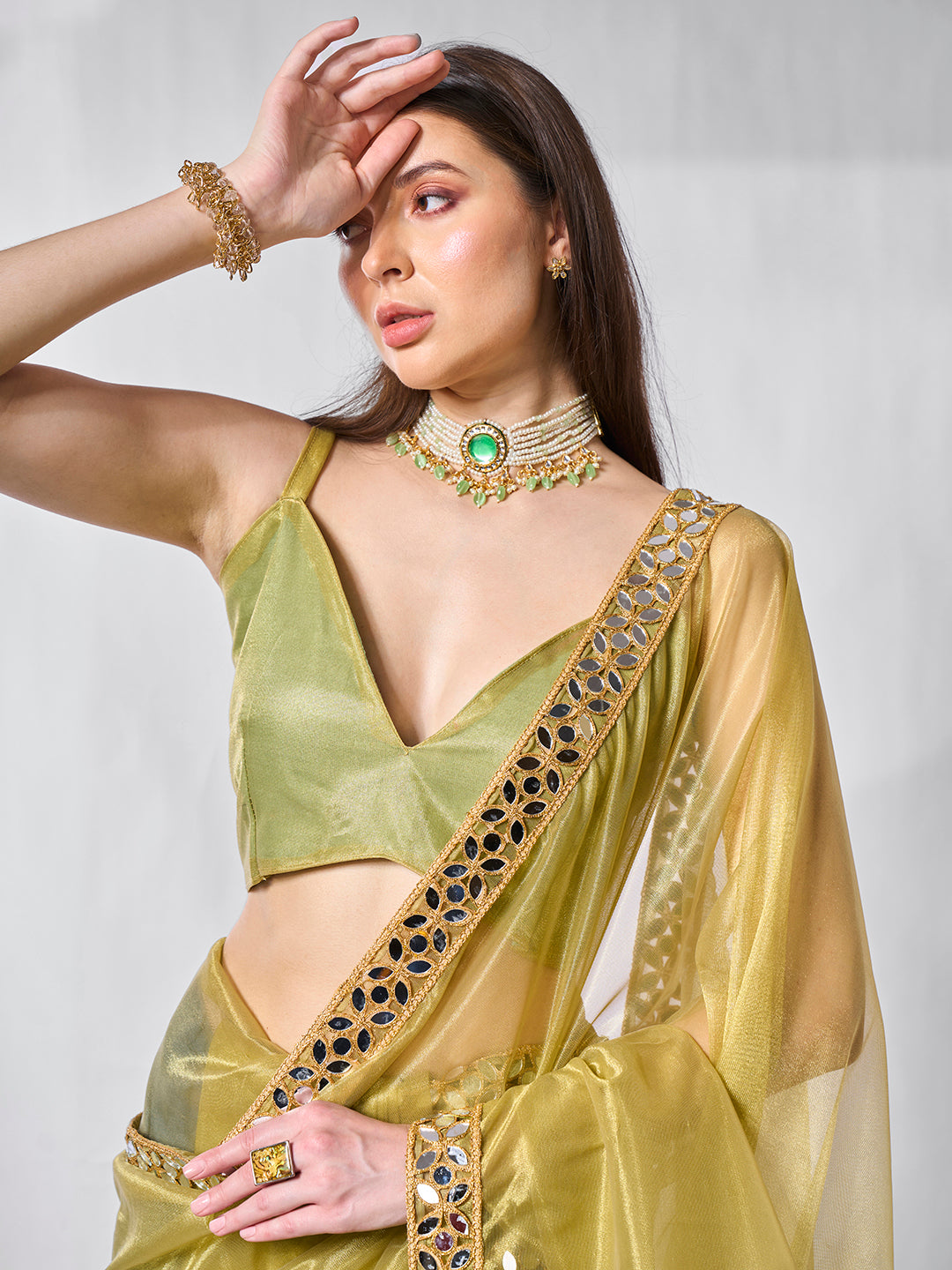 Green Gold Tissue Net Solid Texture Saree With Graceful Gold Cotted