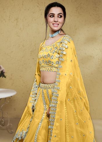Magnetic Yellow Foil Work Net Haldi Wear Lehenga Choli With Dupatta