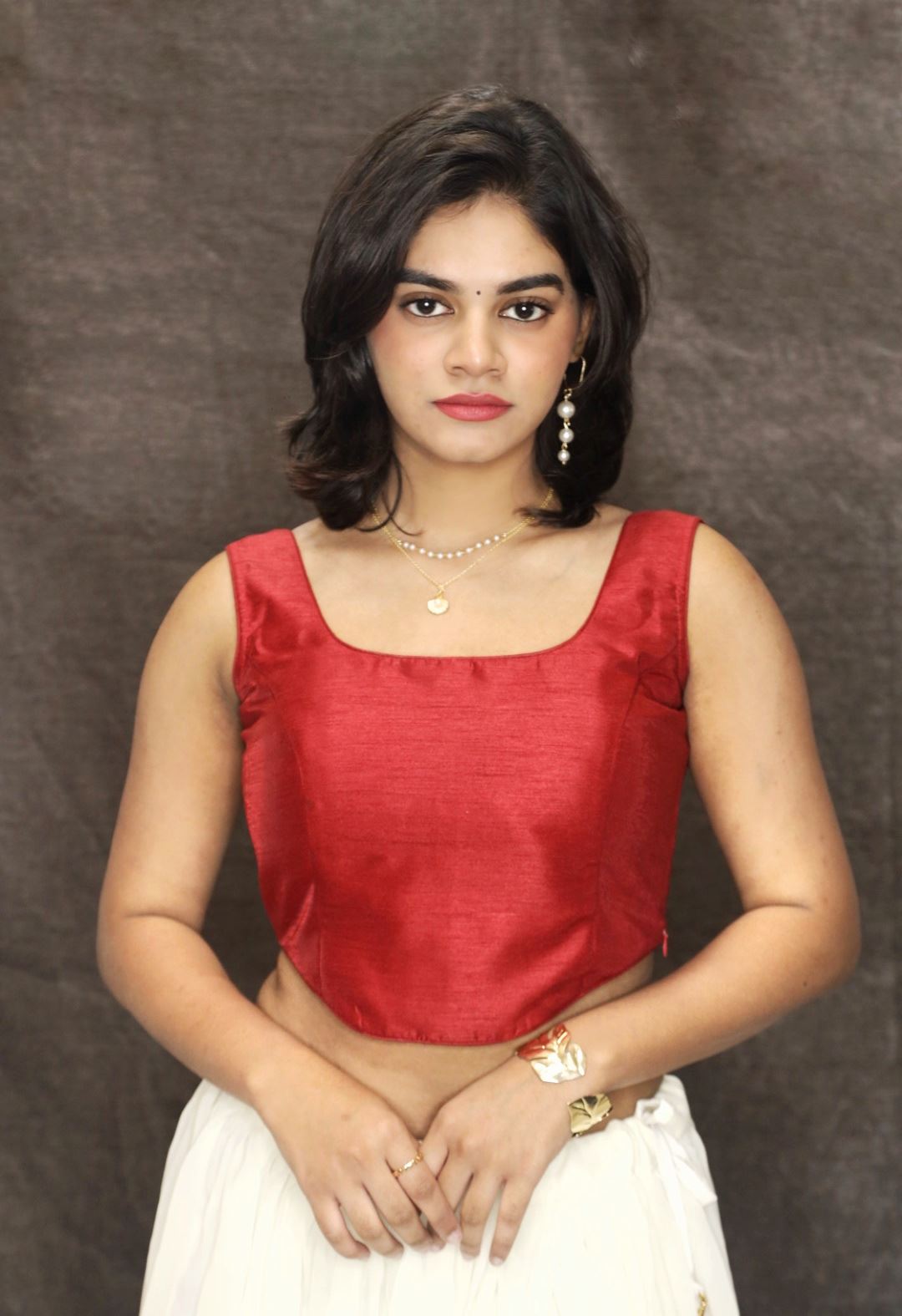 Maroon Corset Blouse In Raw Silk With Scooped Neckline And Tapered High Low Hem