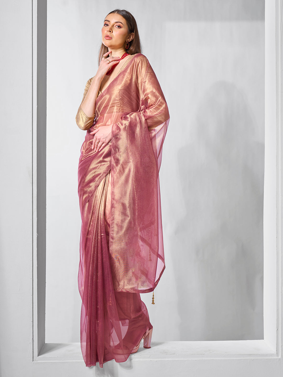 Onion Gold Tissue Net Solid Texture Saree With Graceful Gold Cotted