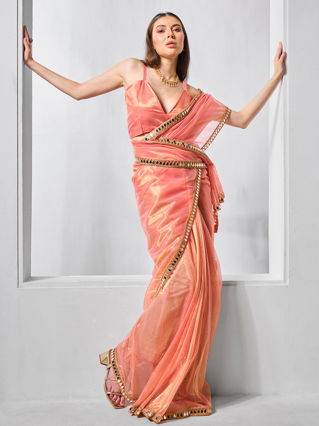 Orange Gold Tissue Net Solid Texture Saree With Graceful Gold Cotted