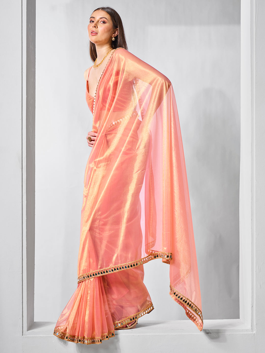 Orange Gold Tissue Net Solid Texture Saree With Graceful Gold Cotted