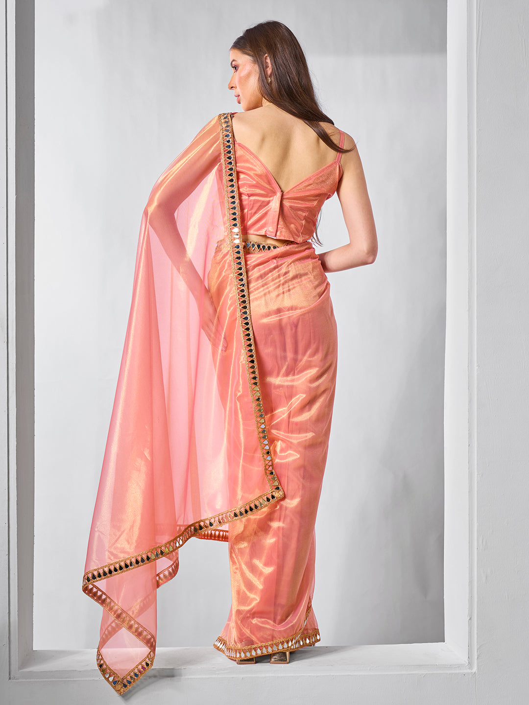 Orange Gold Tissue Net Solid Texture Saree With Graceful Gold Cotted