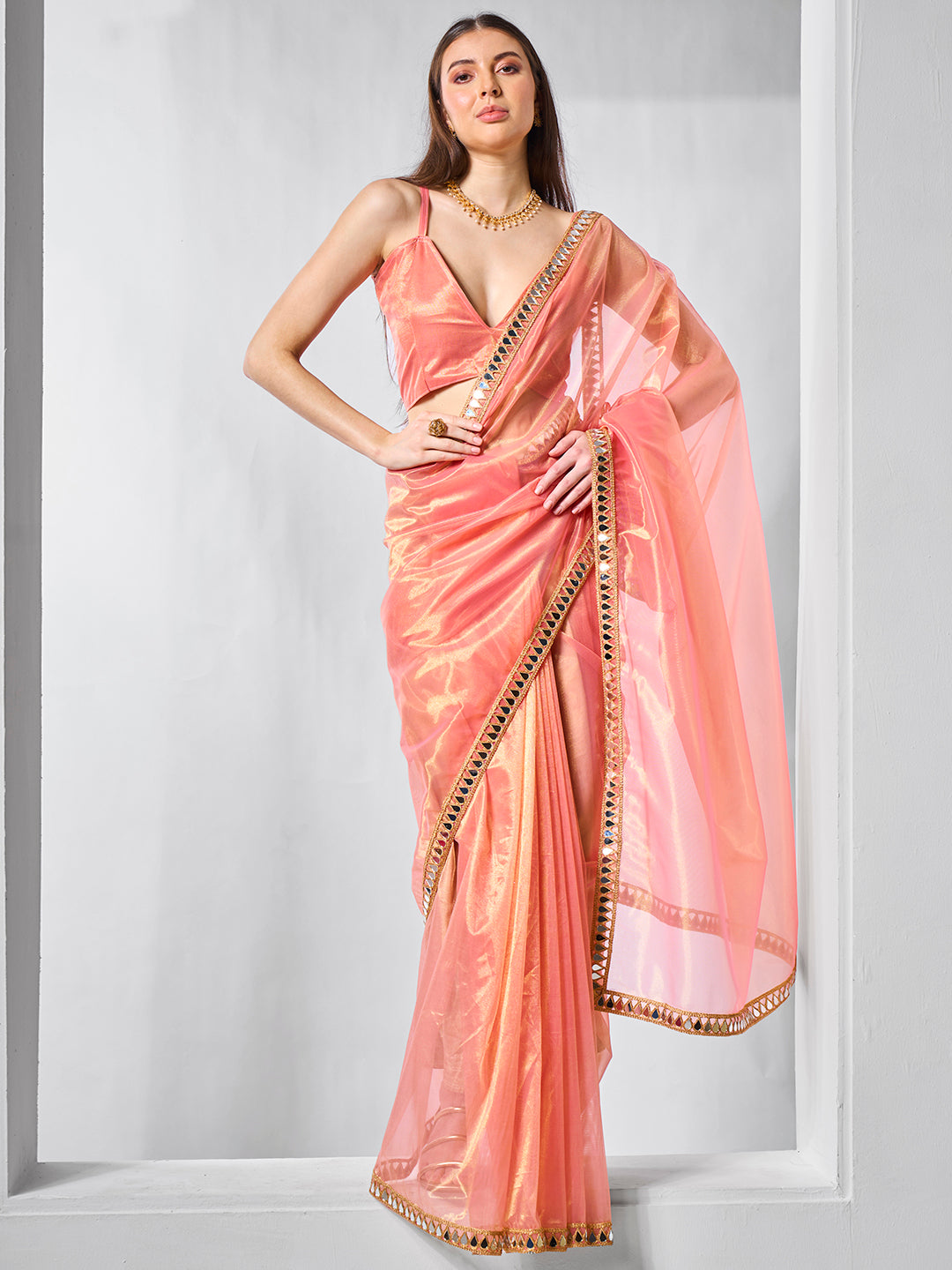 Orange Gold Tissue Net Solid Texture Saree With Graceful Gold Cotted