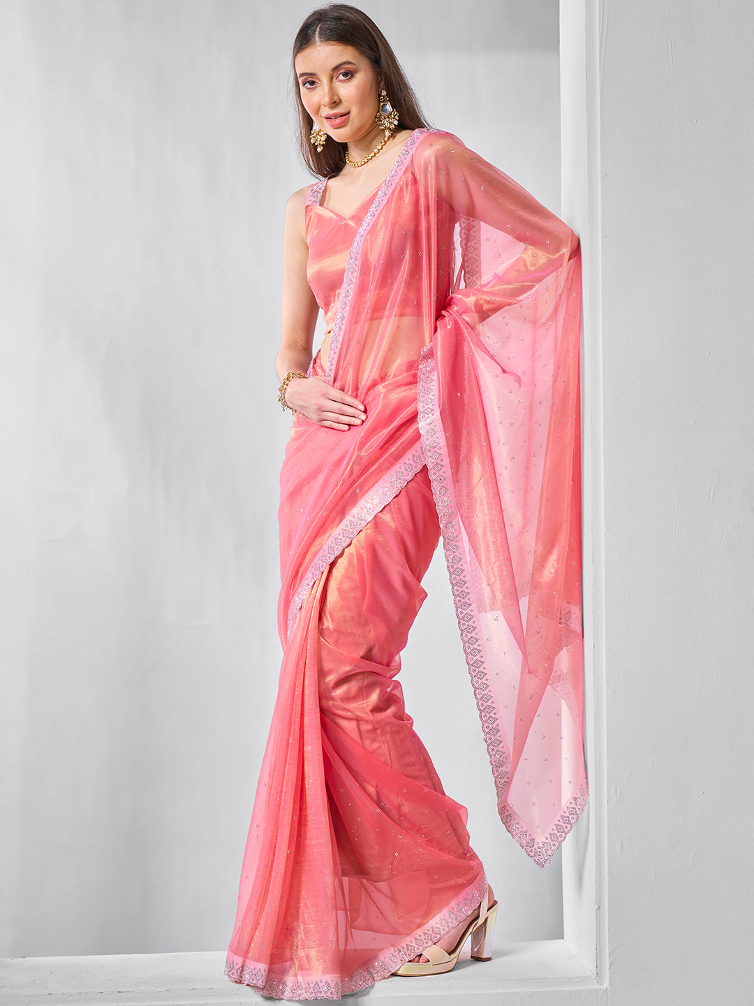 Pink Gold Tissue Net Solid Texture Saree With Graceful Gold Cotted