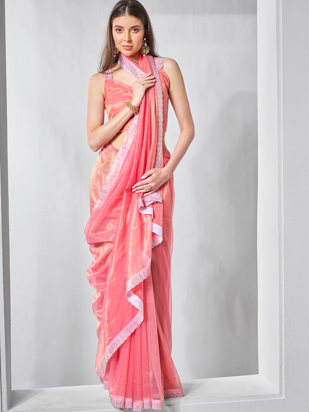Pink Gold Tissue Net Solid Texture Saree With Graceful Gold Cotted