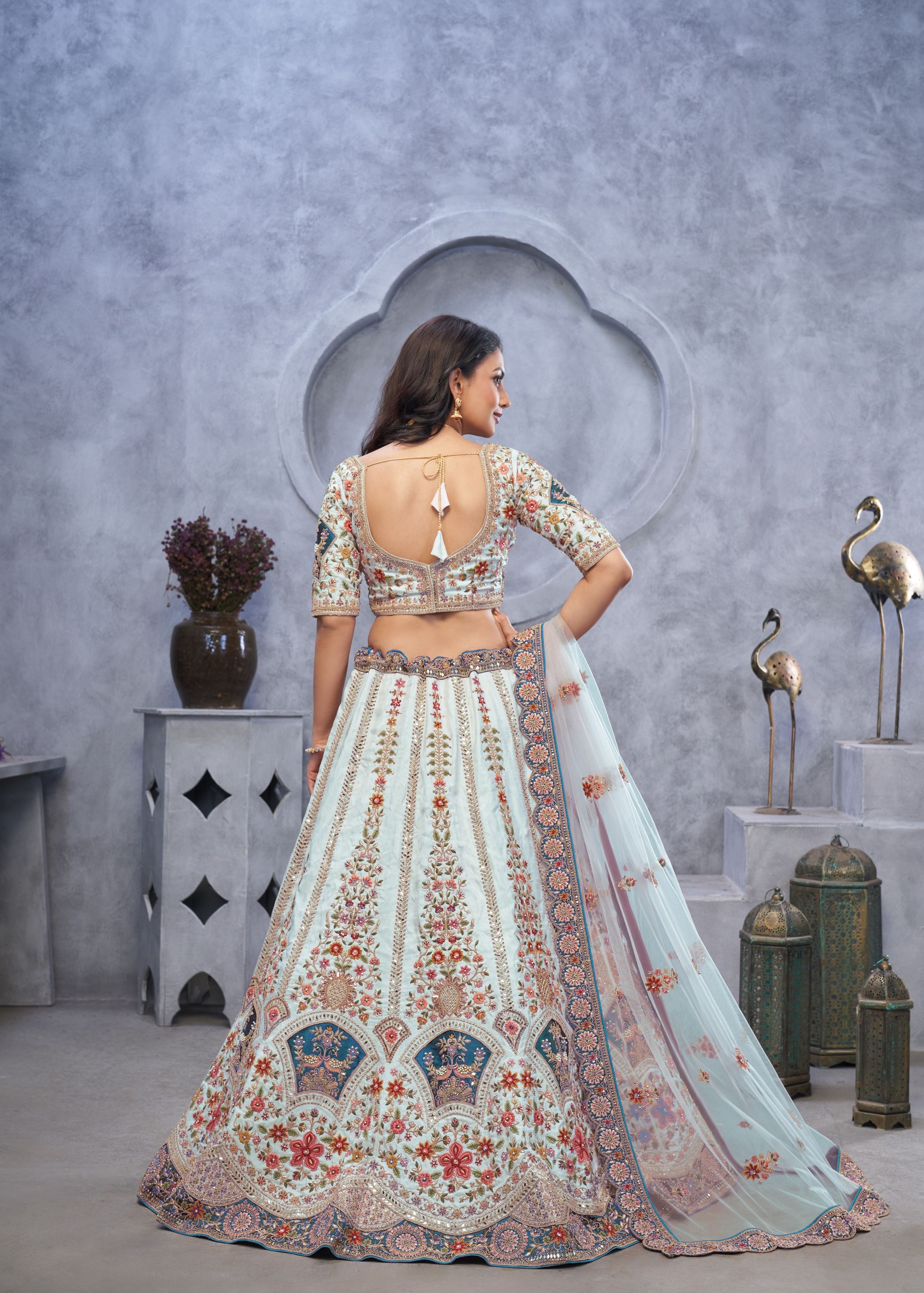 Stunning Sky Blue Lehenga Choli With Zari Paisley Embroidery, Silk Patches, And Regal Peacock Motifs