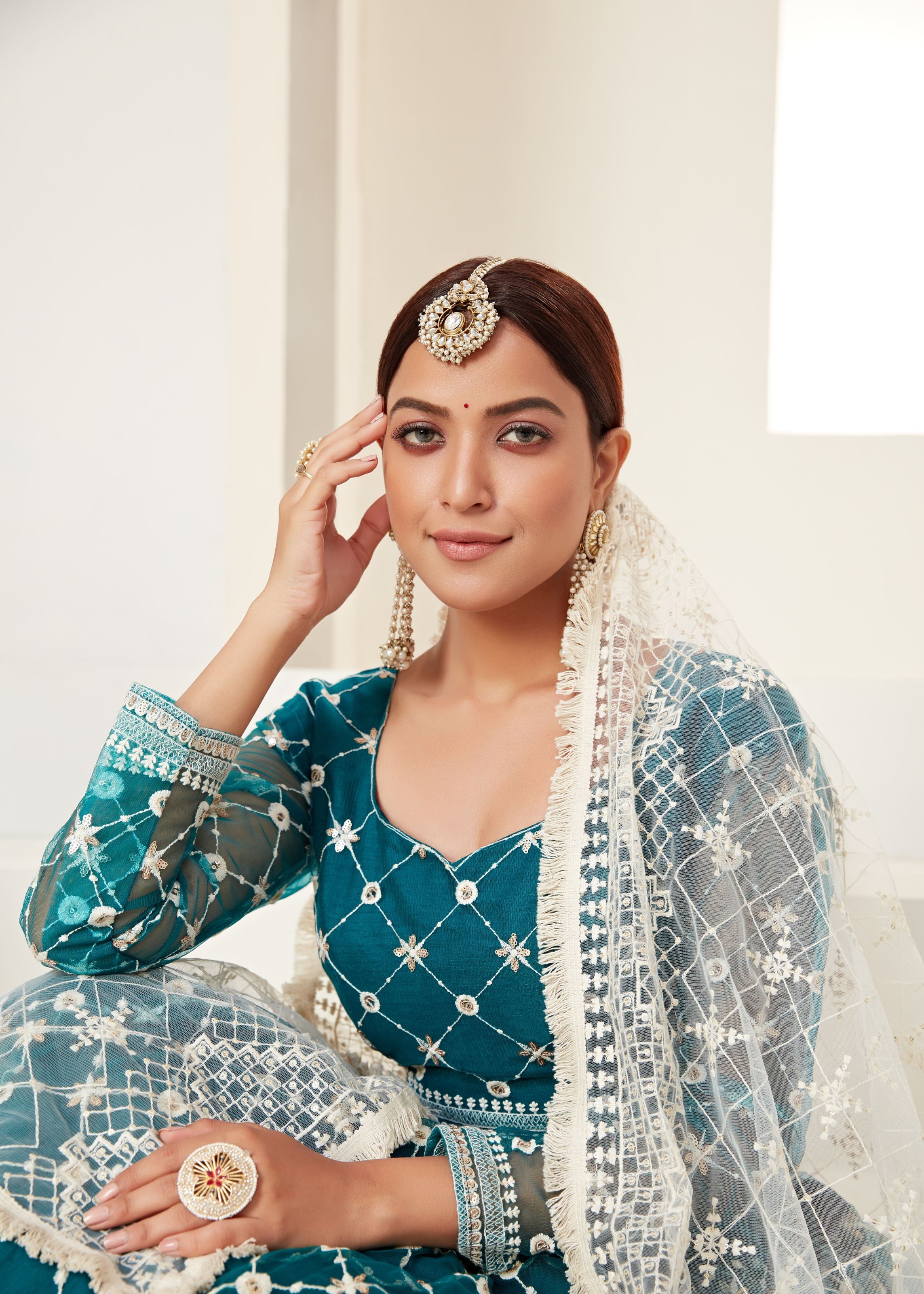 Teal Green Lehenga Choli And Dupatta With Multi Net And Sequence Embroidered Thread Work