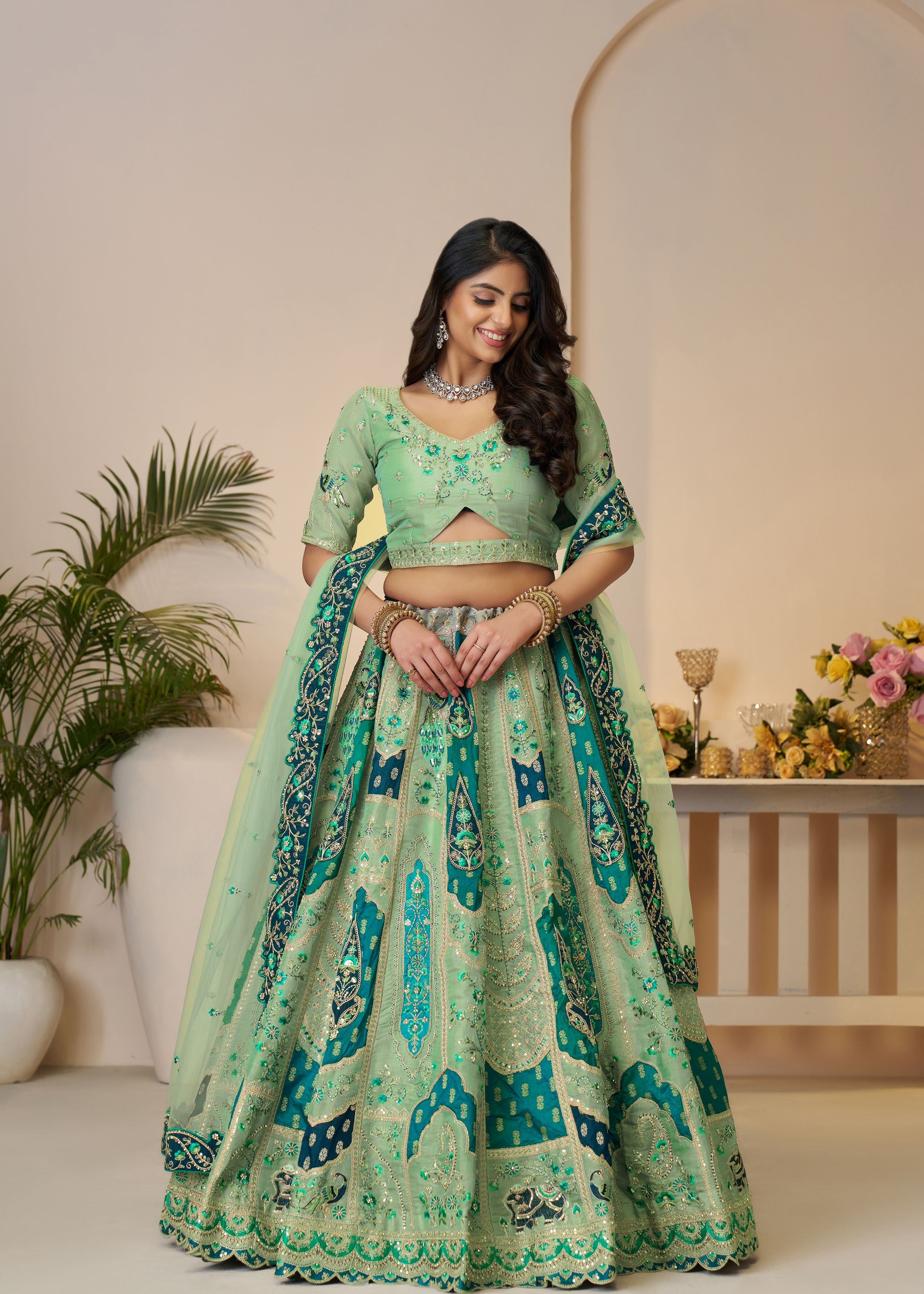 The Rajsi Haathi Collection: Graceful Green With Peacock Embroidered Bridal Lehenga