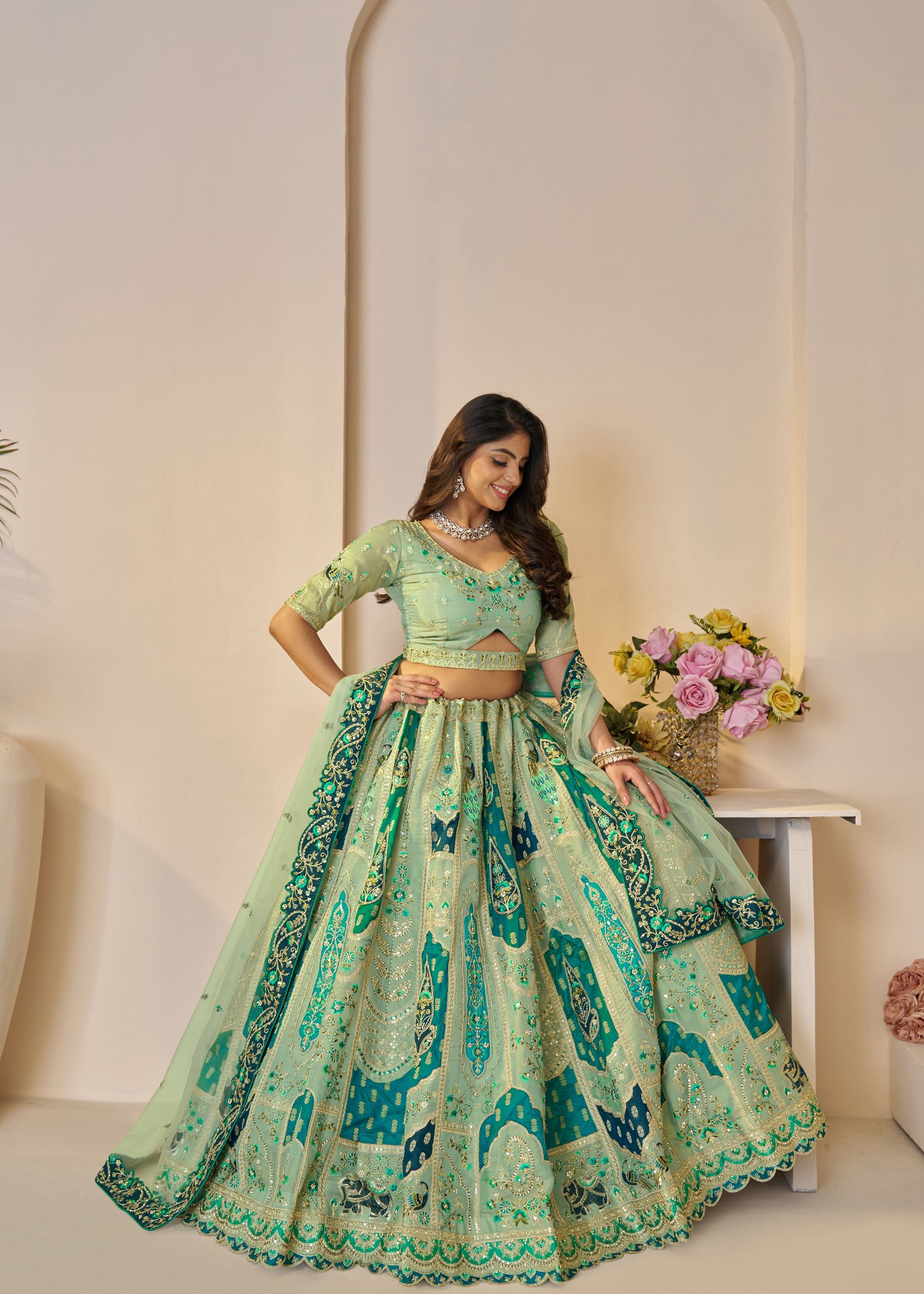 The Rajsi Haathi Collection: Graceful Green With Peacock Embroidered Bridal Lehenga