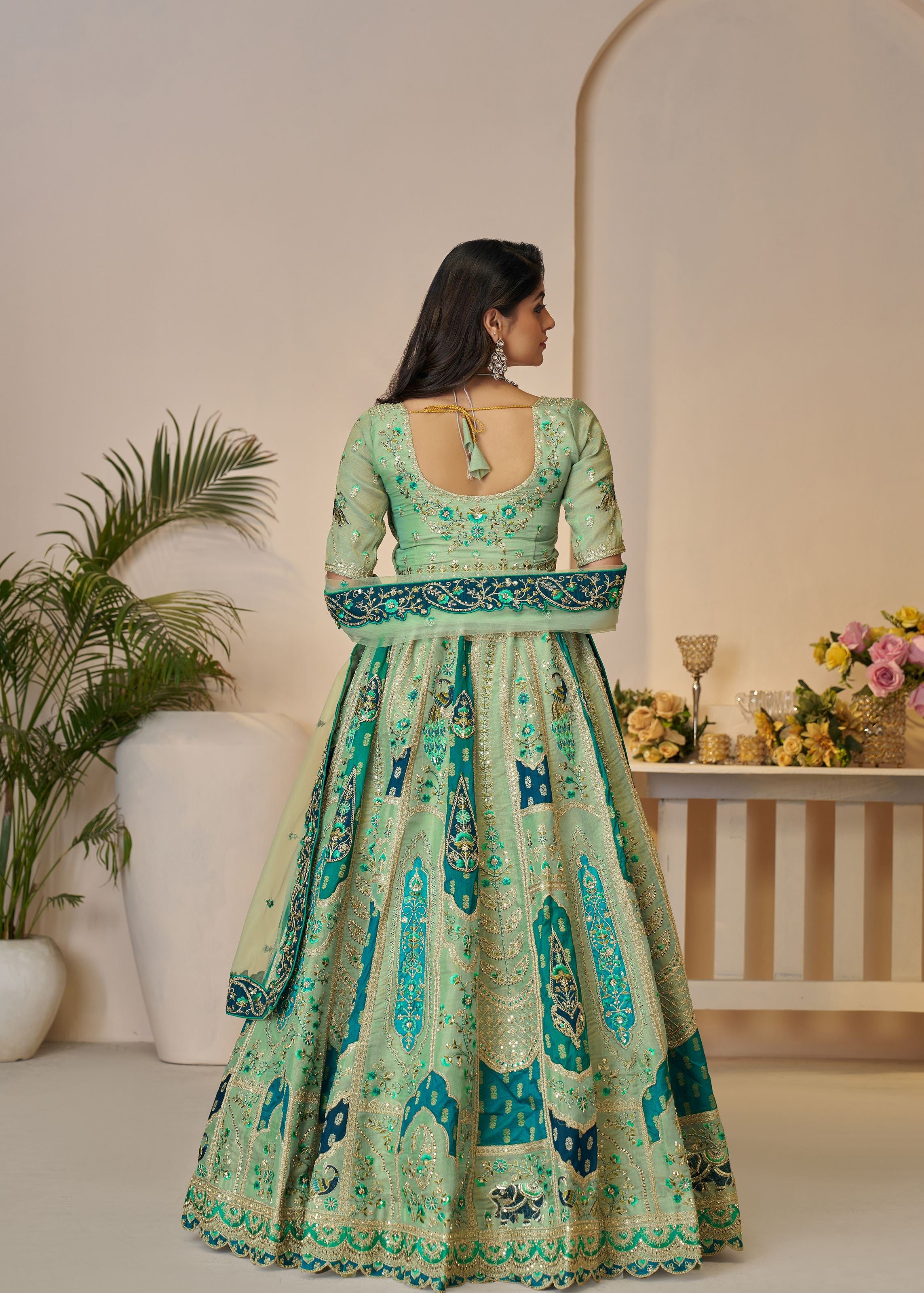 The Rajsi Haathi Collection: Graceful Green With Peacock Embroidered Bridal Lehenga
