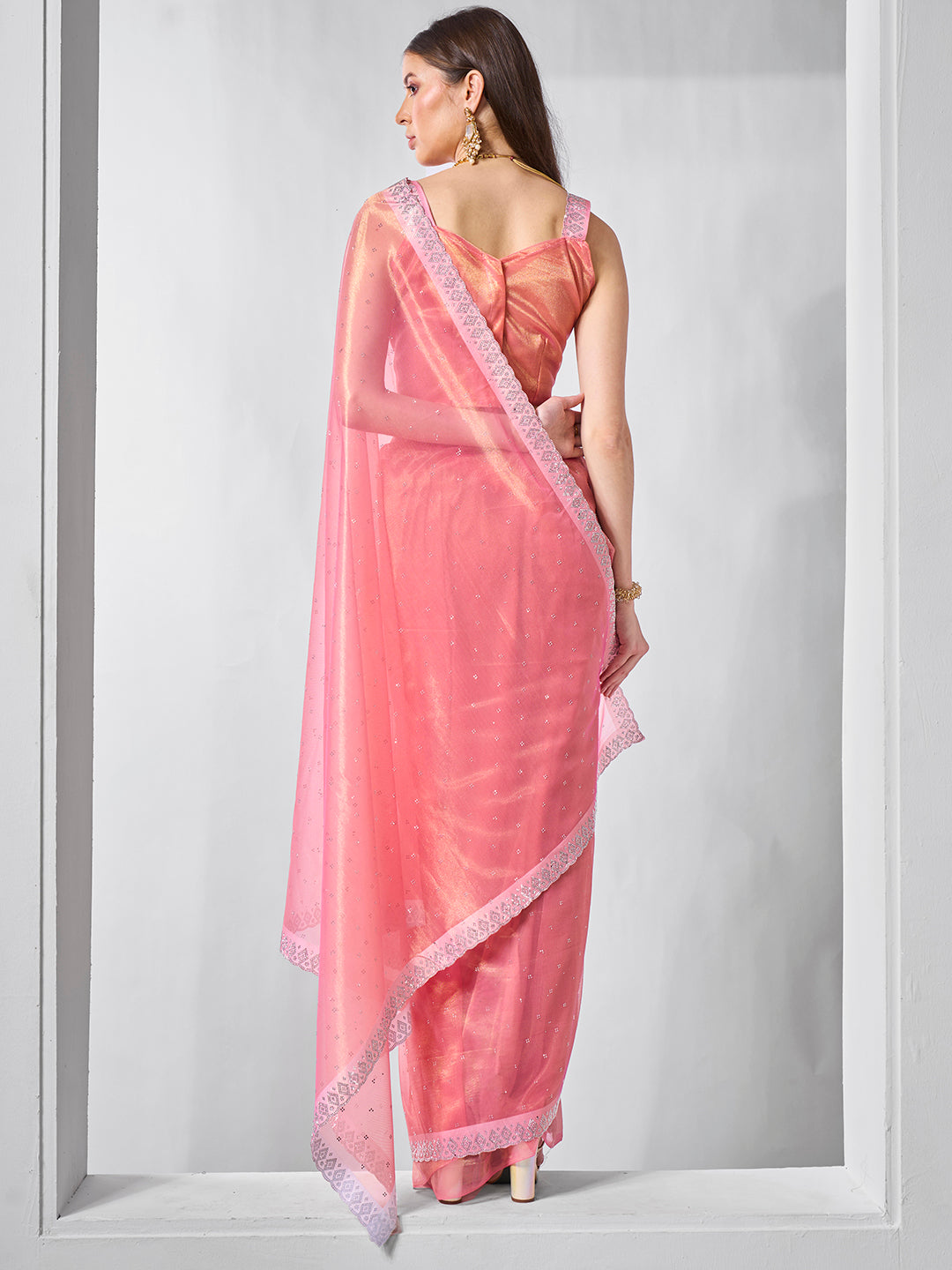 Pink Gold Tissue Net Solid Texture Saree With Graceful Gold Cotted