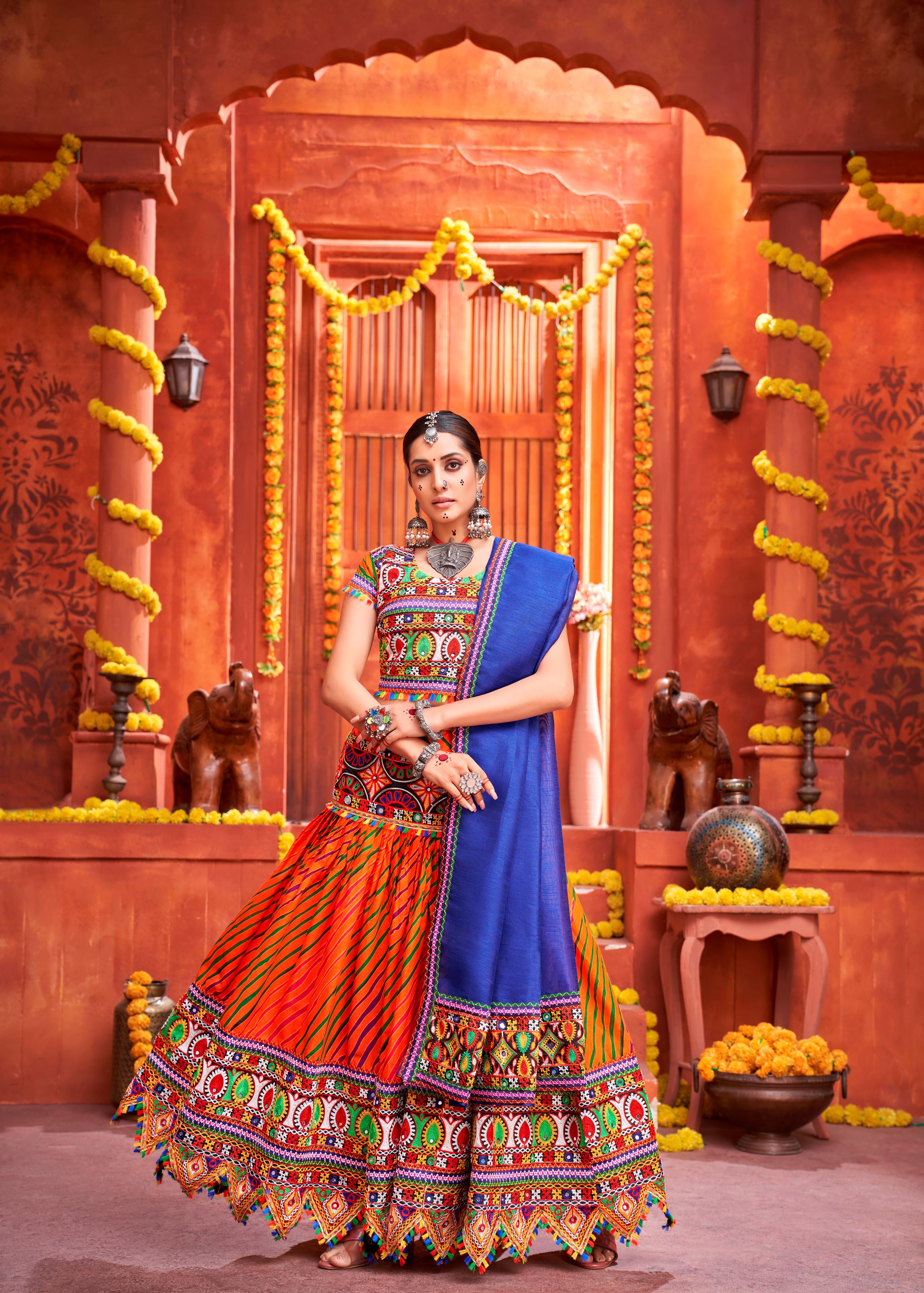 Orange And Royal Blue Navratri Chaniya Choli With Laheriya Print With Gamthi Work And Real Mirror  Work