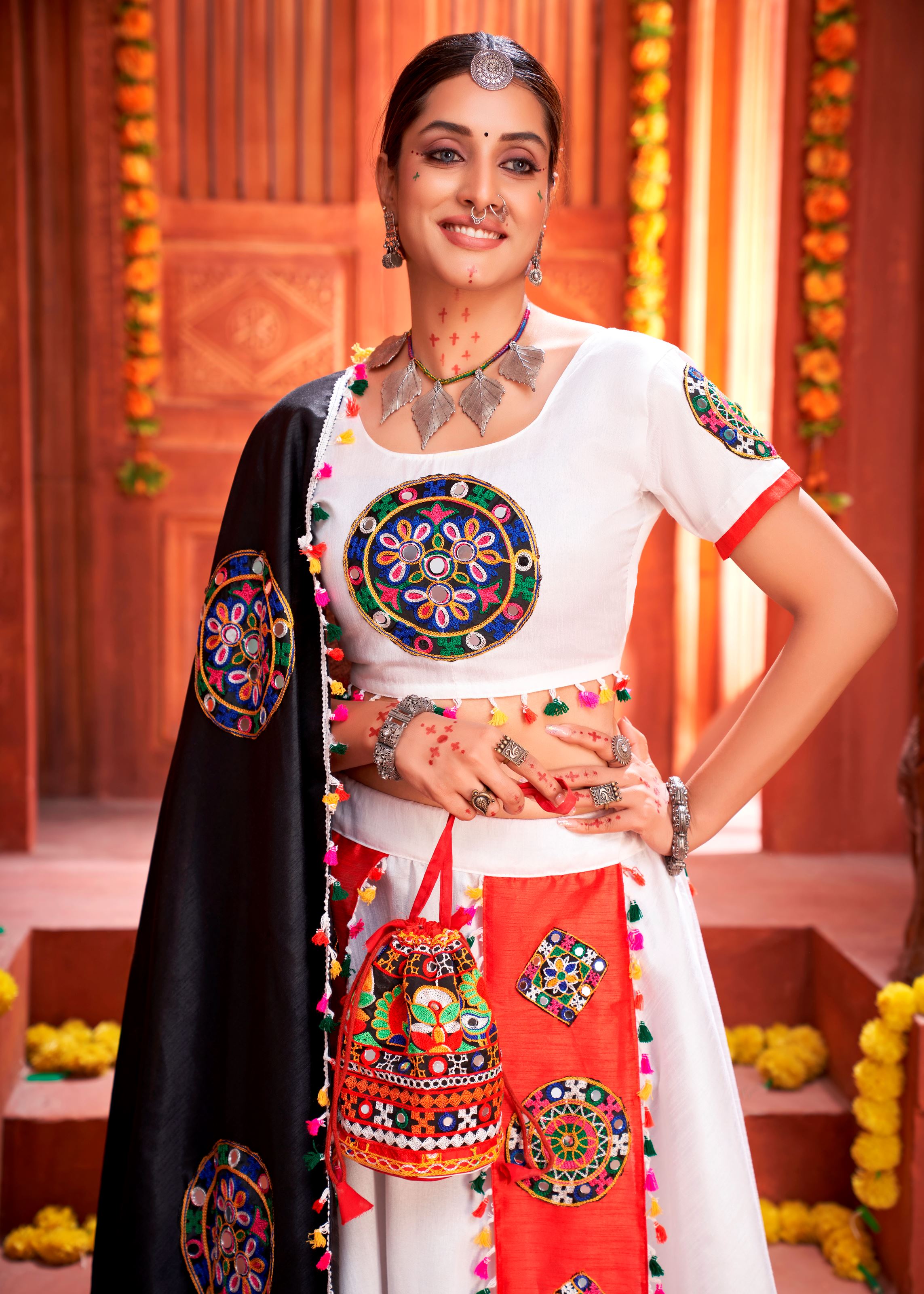 White And Orange Navratri Chaniya Choli With Gamthi Work Butta And Lace With Mirror Hand Work