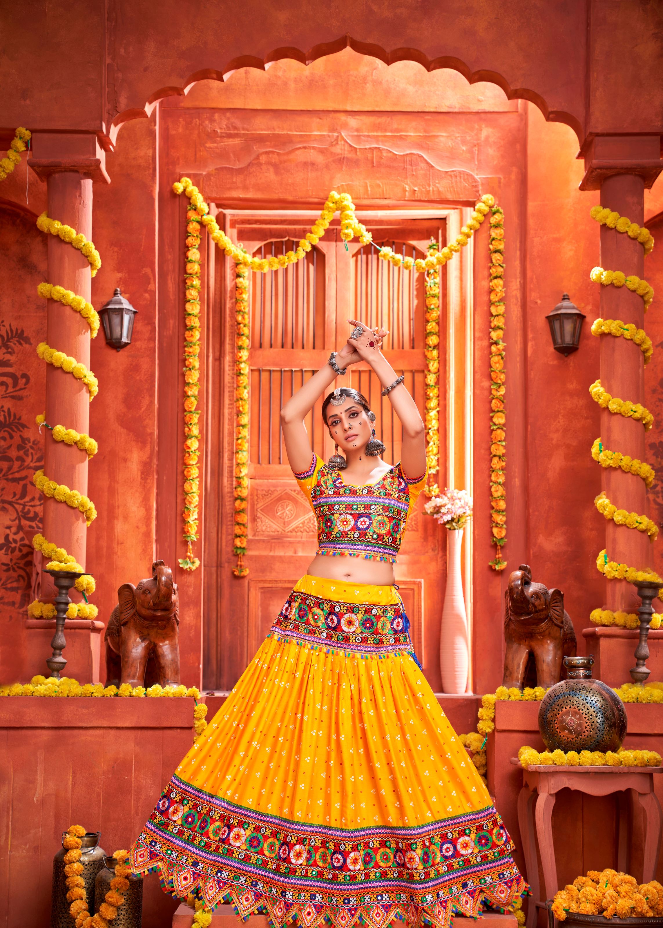 Yellow And Red Navratri Chaniya Choli With Patola Print With Gamthi Work And Real Mirror Work