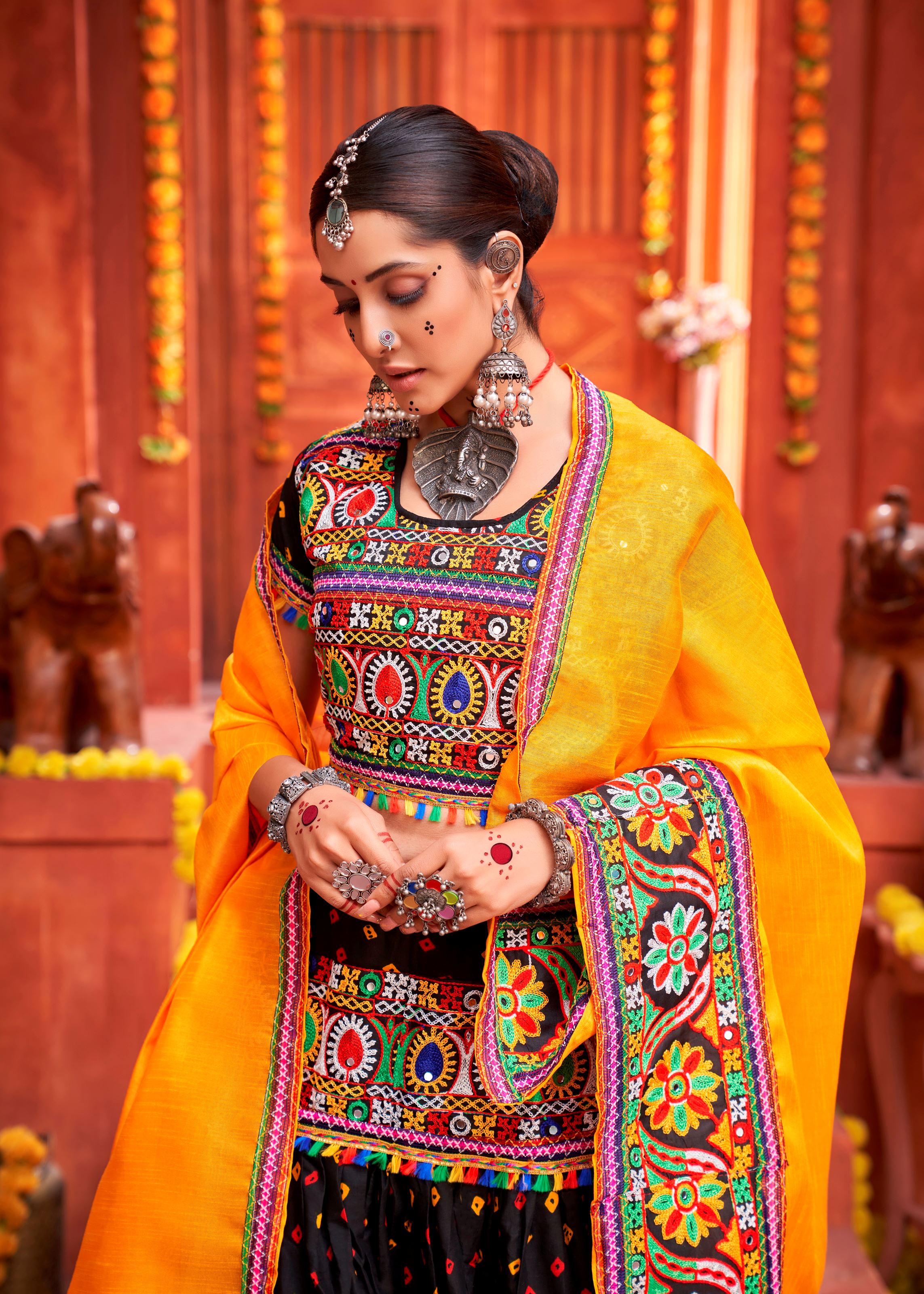 Black And Yellow Navratri Chaniya Choli With Bandhani Print With Gamthi Work And Real Mirror Work