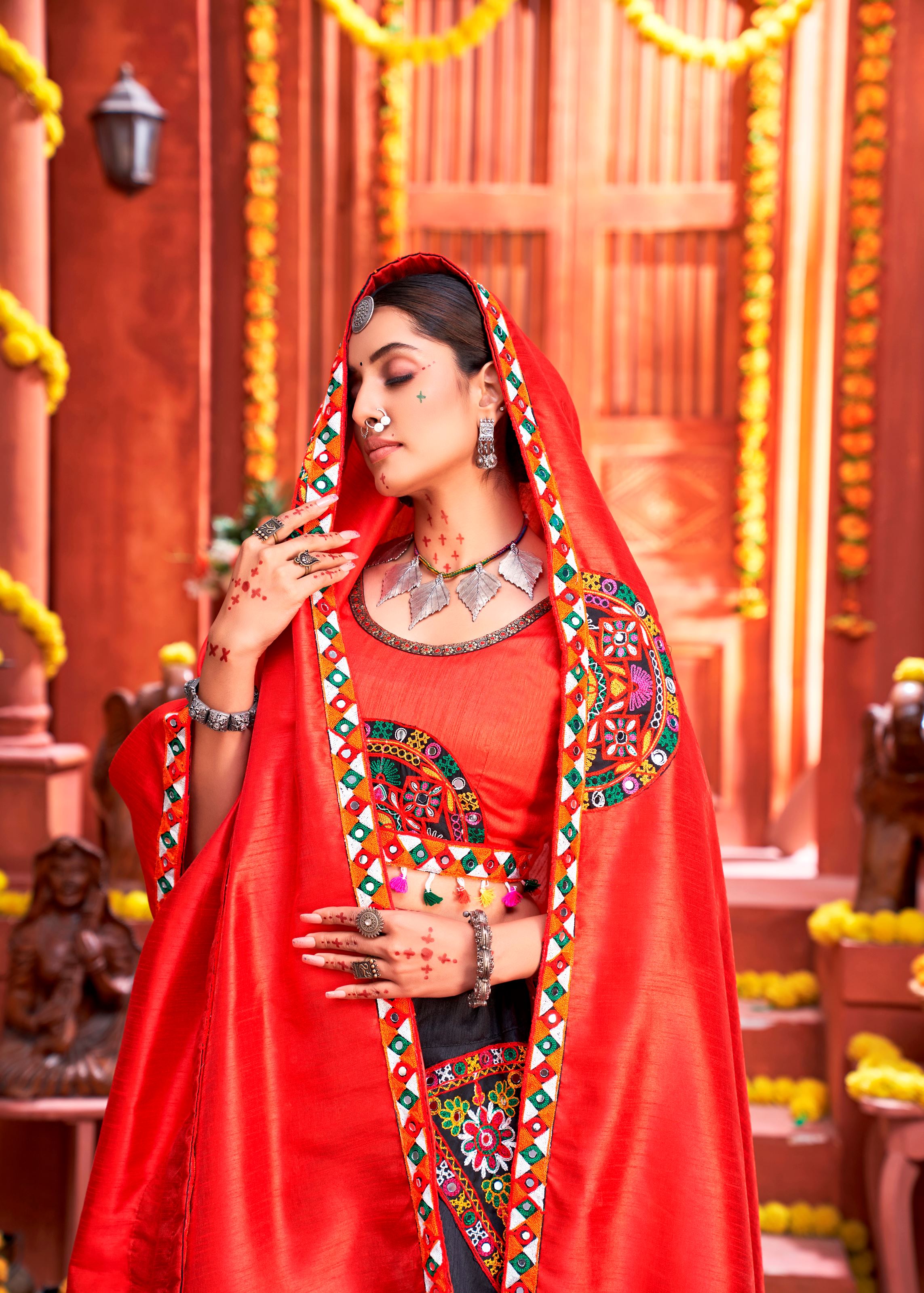 Black And Orange Navratri Chaniya Choli With Gamthi Work Butta And Lace With Mirror Hand Work