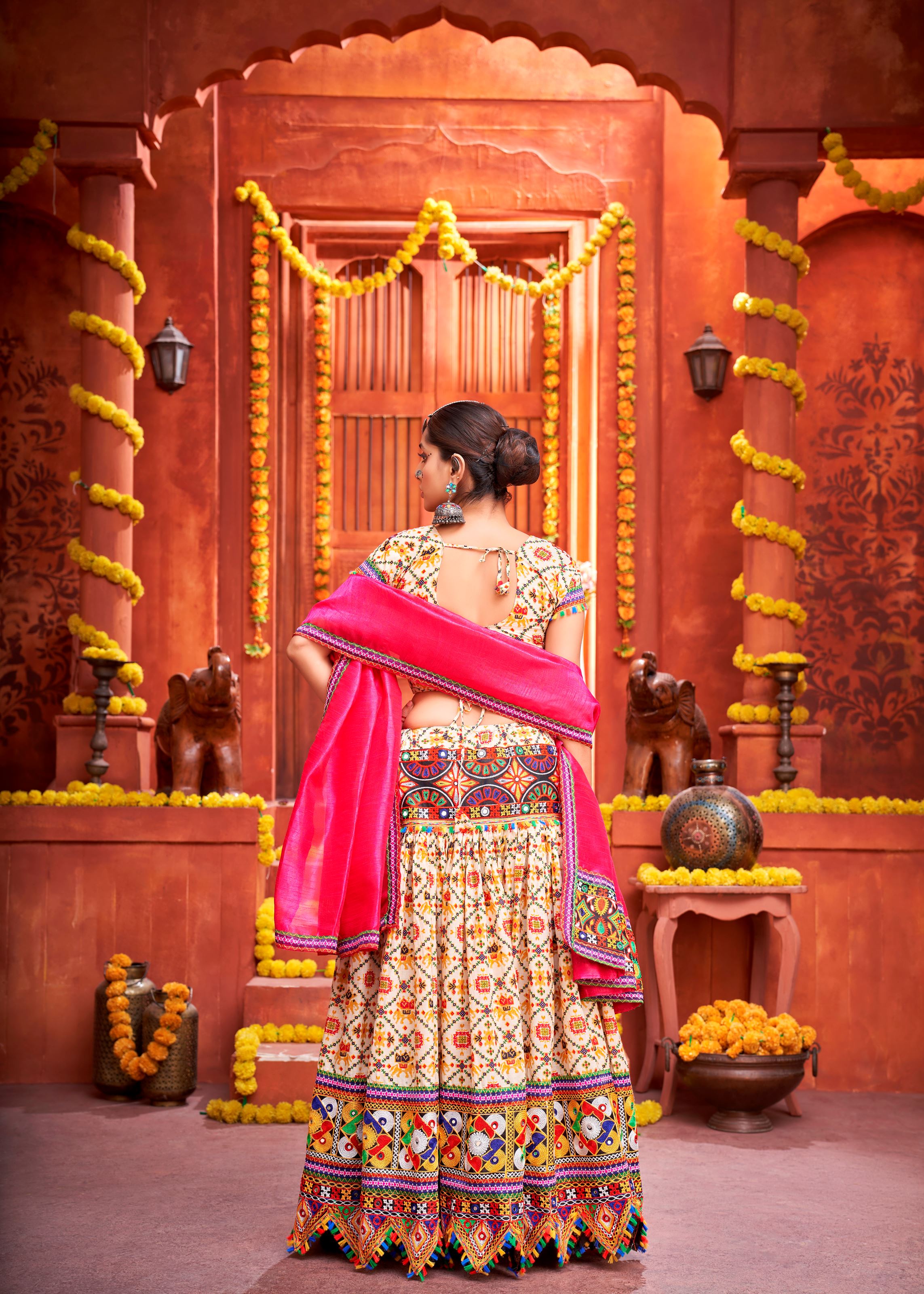 Cream And Pink Navratri Chaniya Choli With Gamthi Work And Pattola Print With Mirror Work
