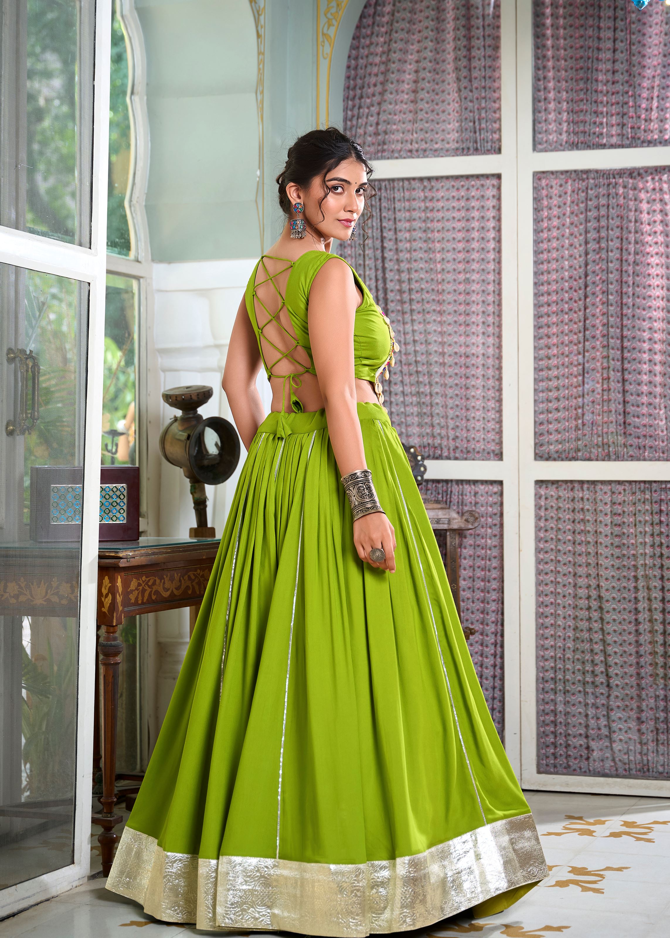 Parrot Classic Rayon Lehenga Choli with Gota Patti and Lace Accents