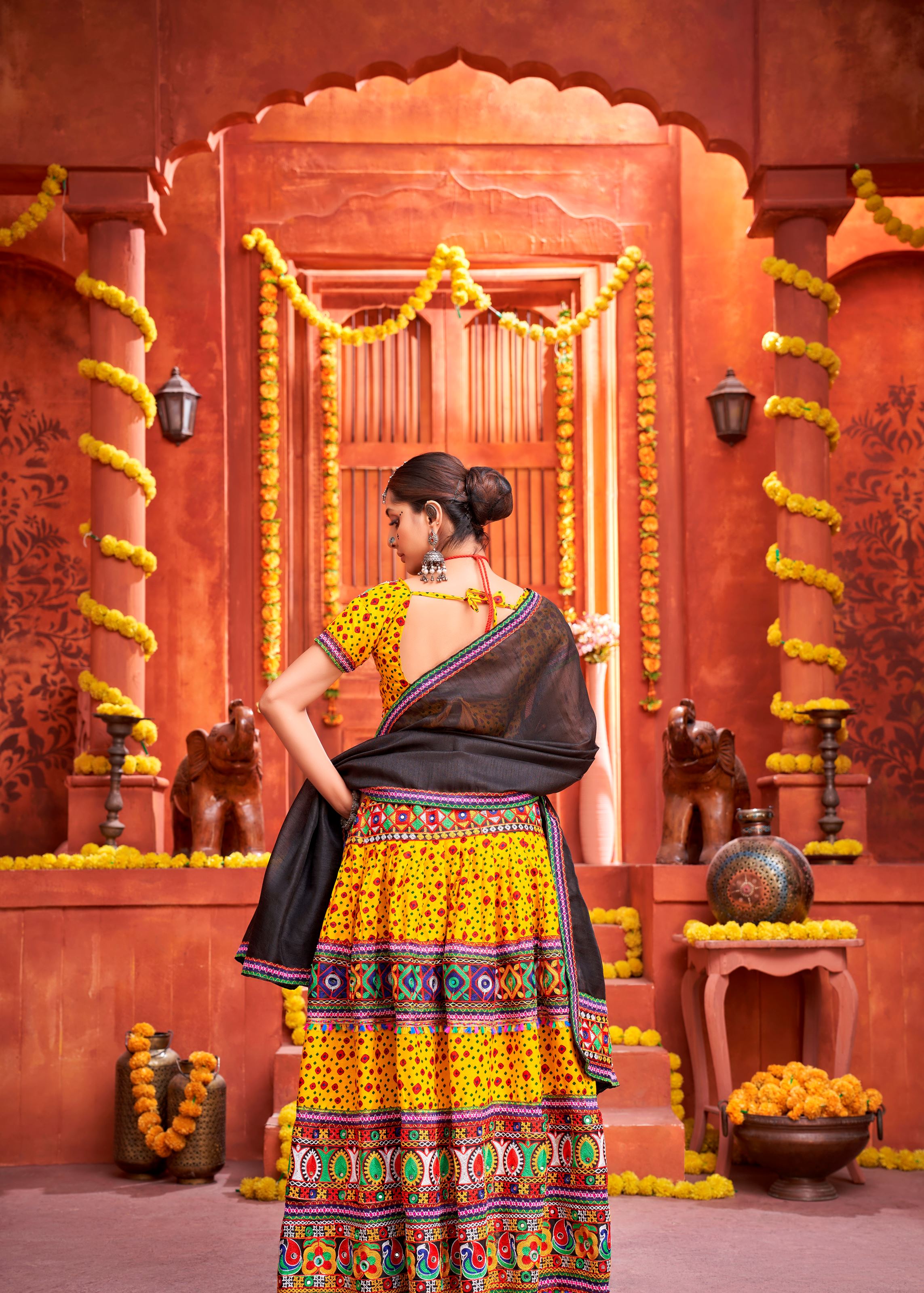 Yellow And Black Navratri Chaniya Choli With Patola Print And Gamthi Work And Real Mirror  Work
