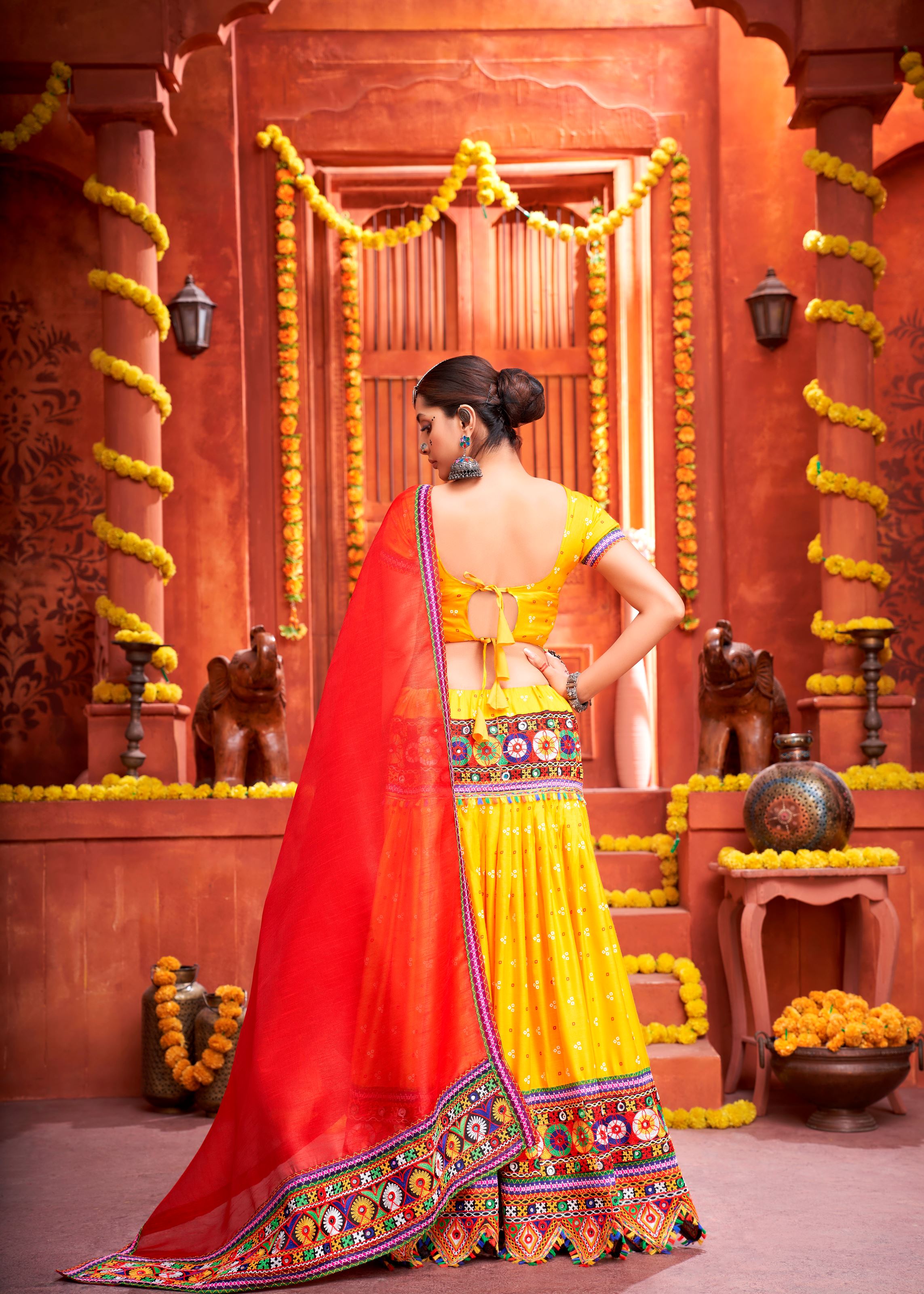 Yellow And Red Navratri Chaniya Choli With Patola Print With Gamthi Work And Real Mirror Work