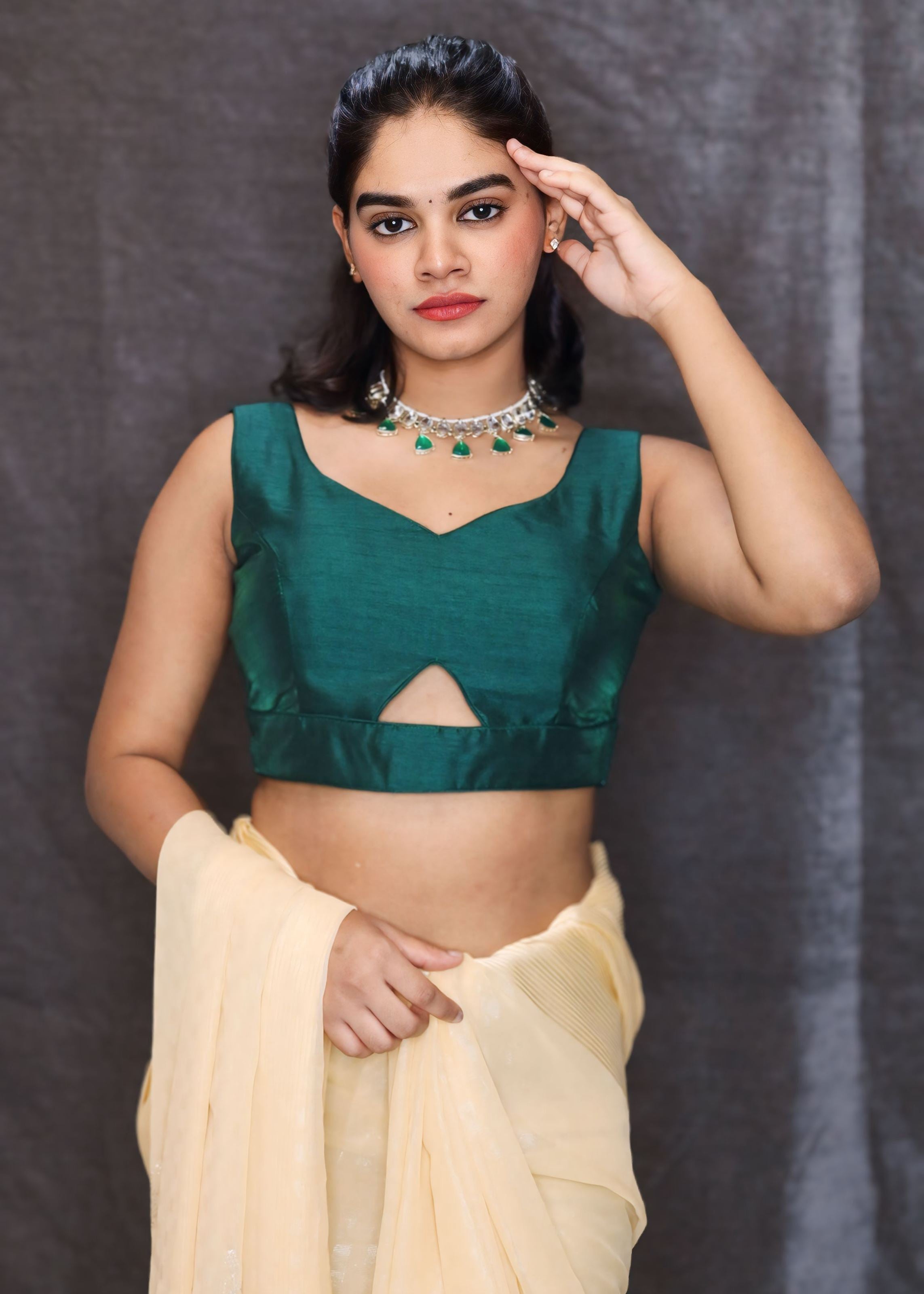 Bottle Green Sleeveless Blouse With A Triangle Cut Out At The Bottom and Back