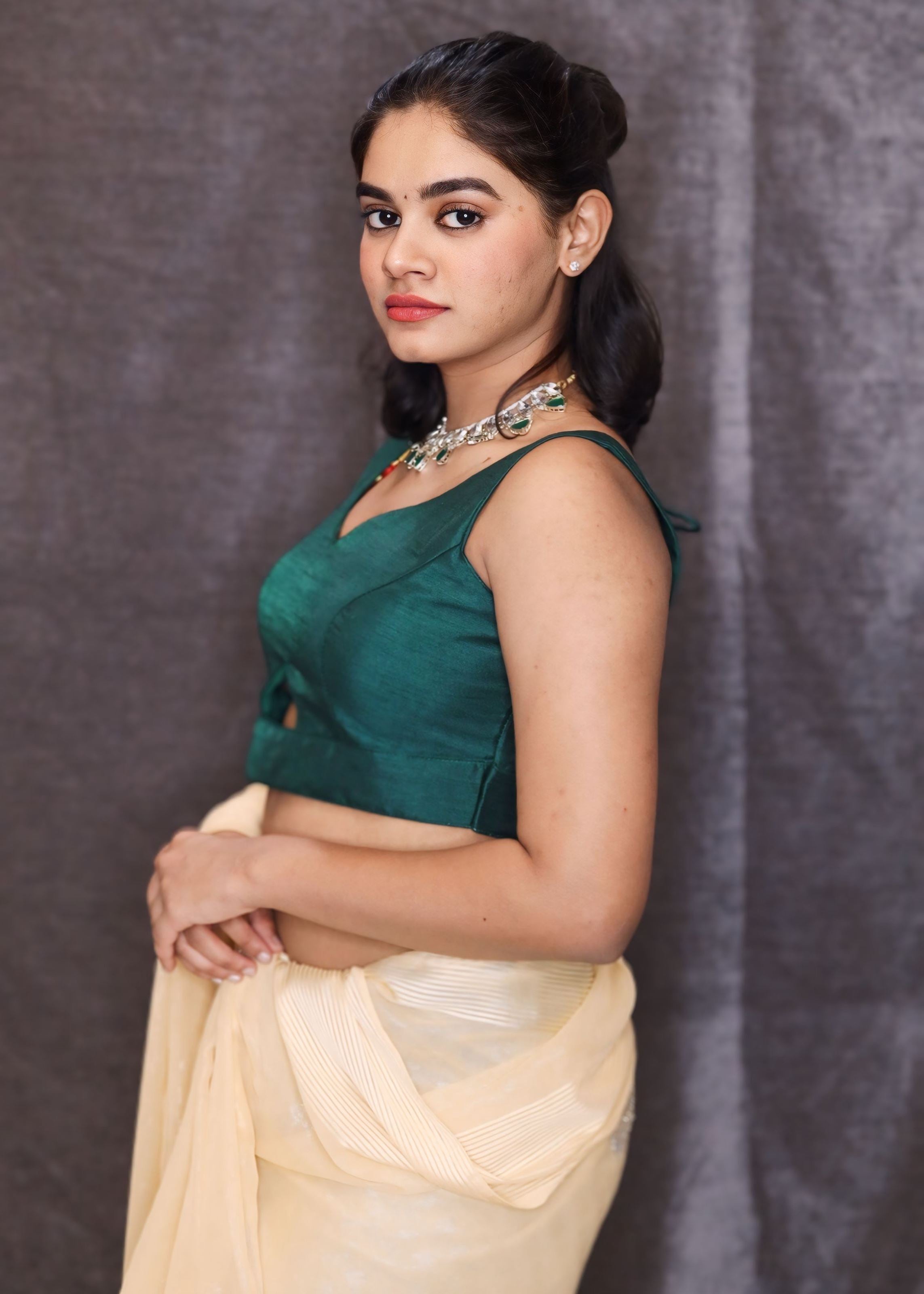 Bottle Green Sleeveless Blouse With A Triangle Cut Out At The Bottom and Back