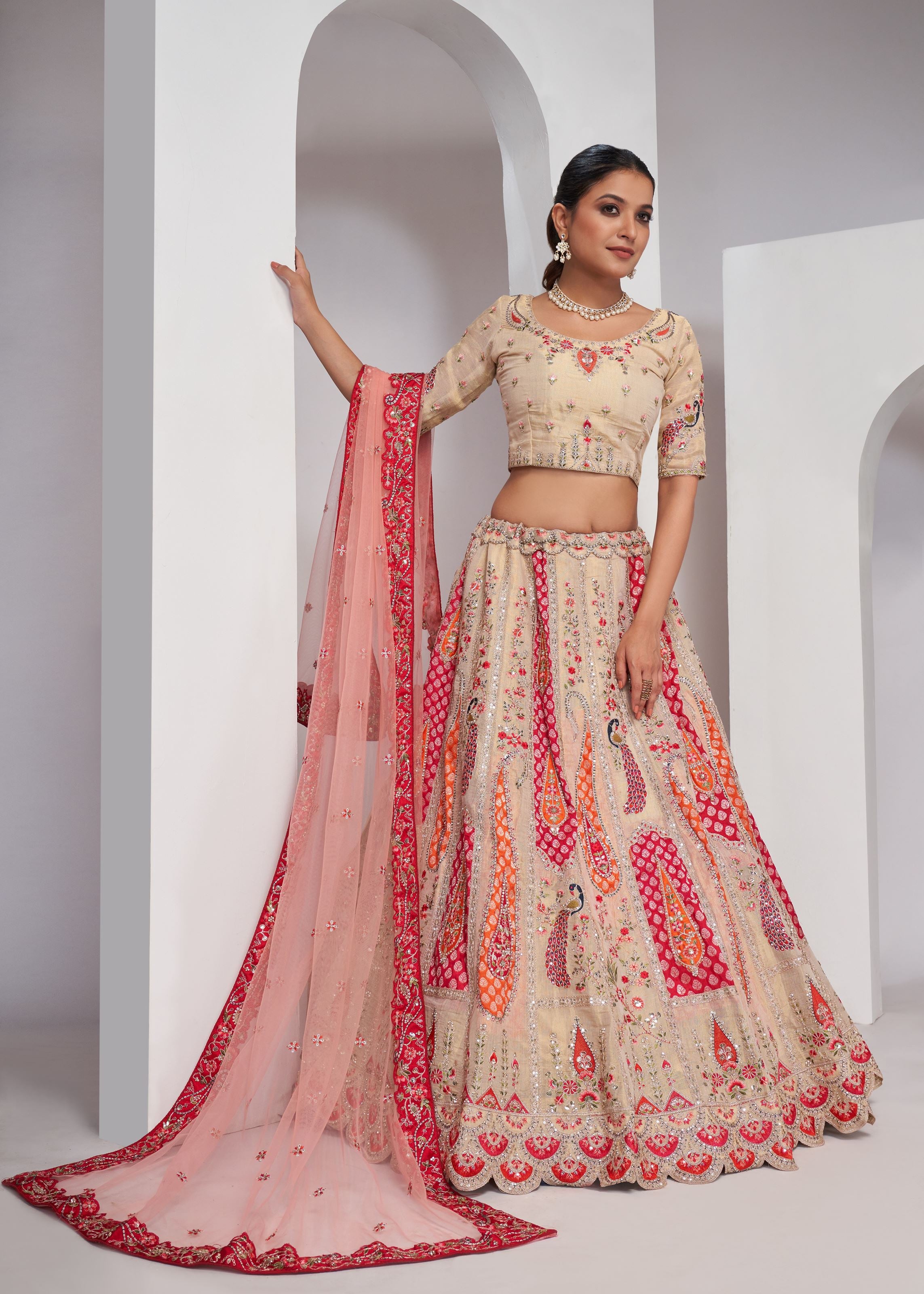 Chiku Banarasi Silk Lehenga Choli With Paisely Motifs Beautiful Peacock Embroidered In Bright Cream Colour