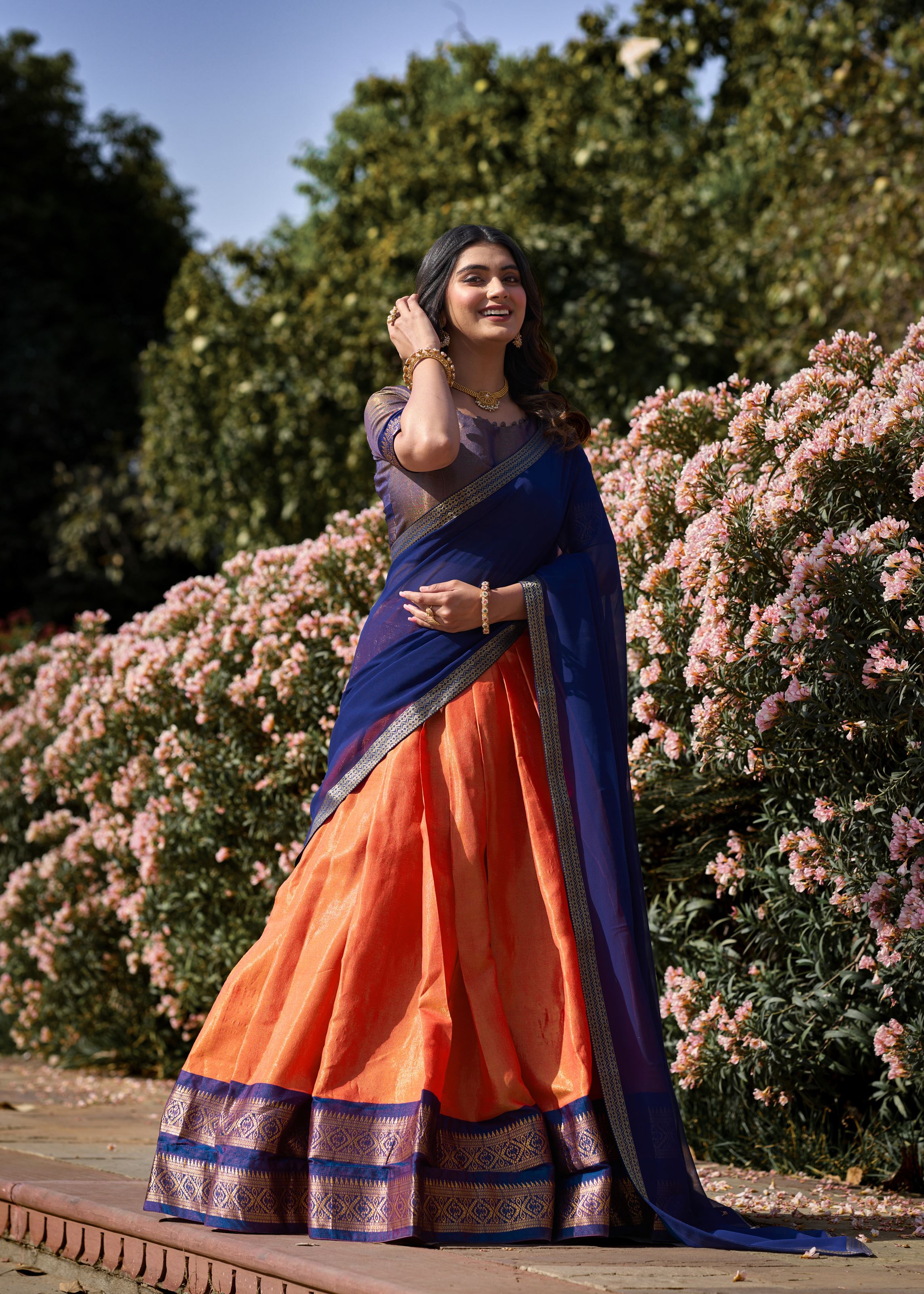 Golden Glow Zari Woven Orange Kanchipuram Lehenga for Festive Grandeur