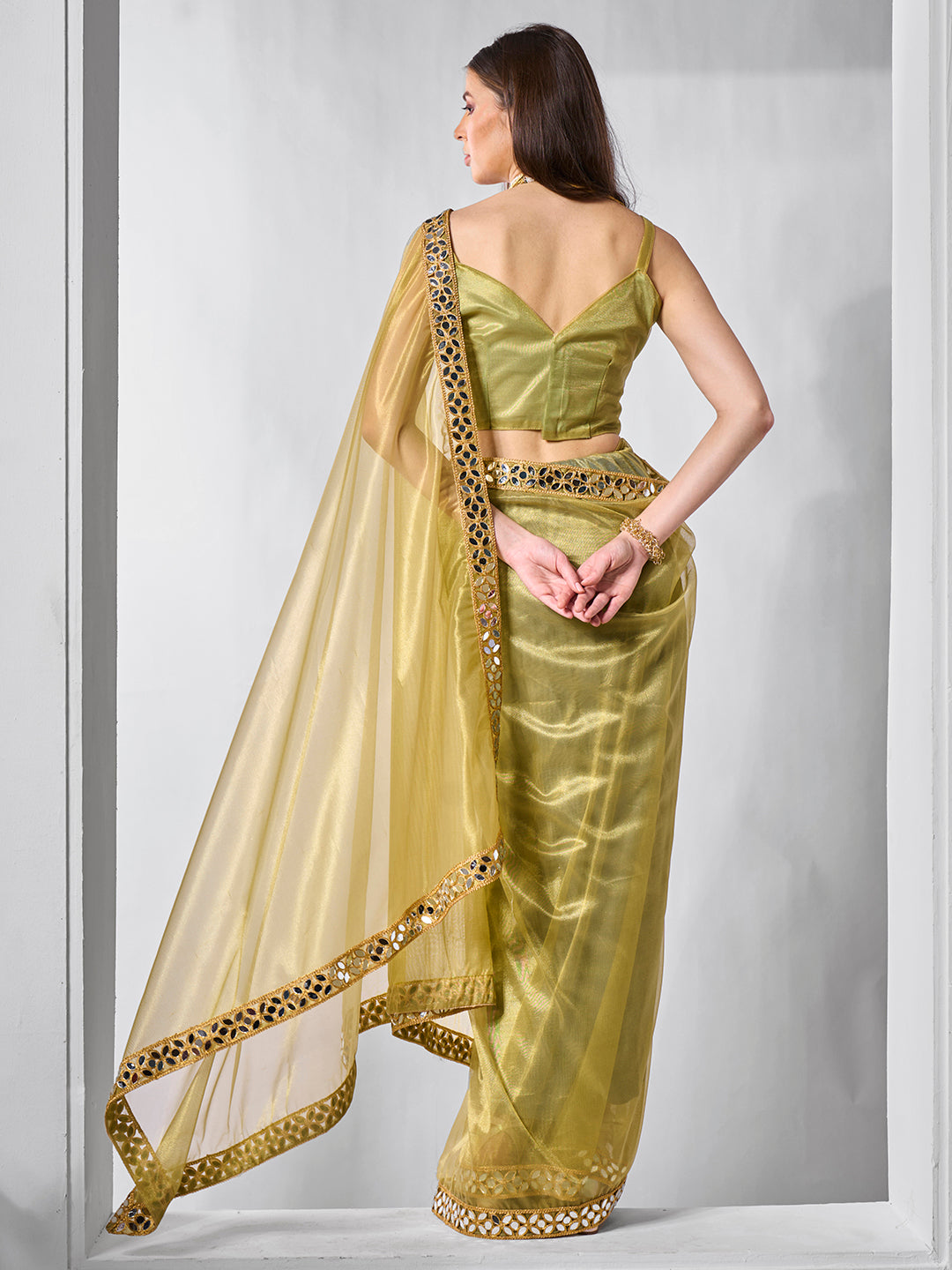 Green Gold Tissue Net Solid Texture Saree With Graceful Gold Cotted