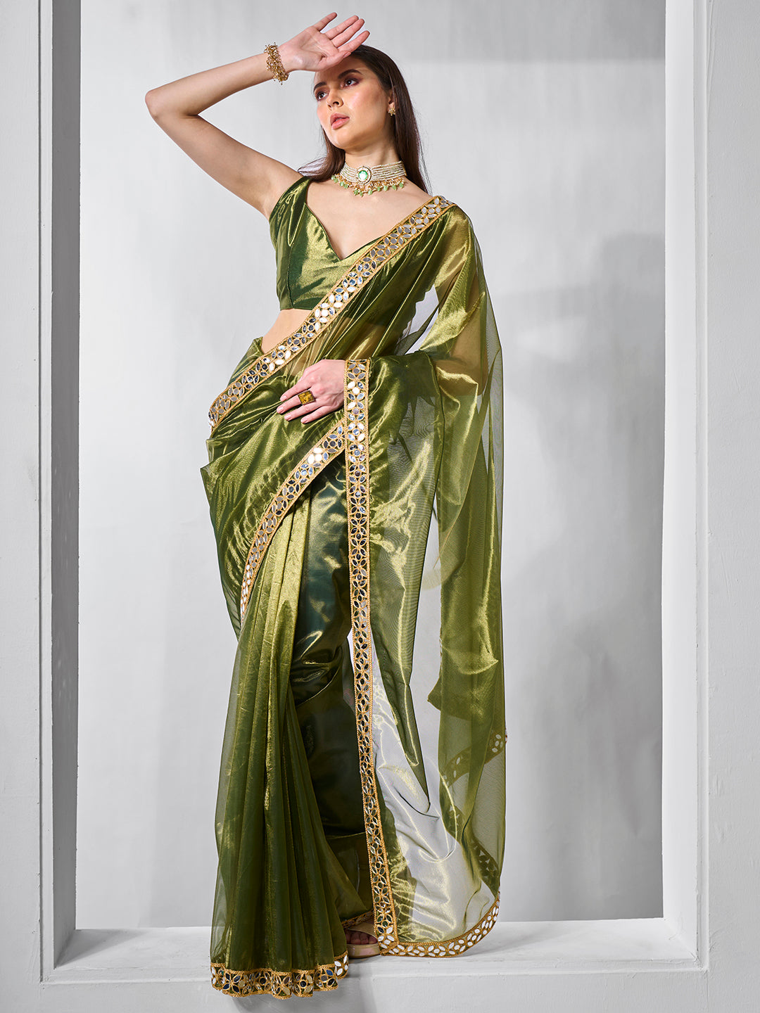Green Gold Tissue Net Solid Texture Saree With Graceful Gold Cotted