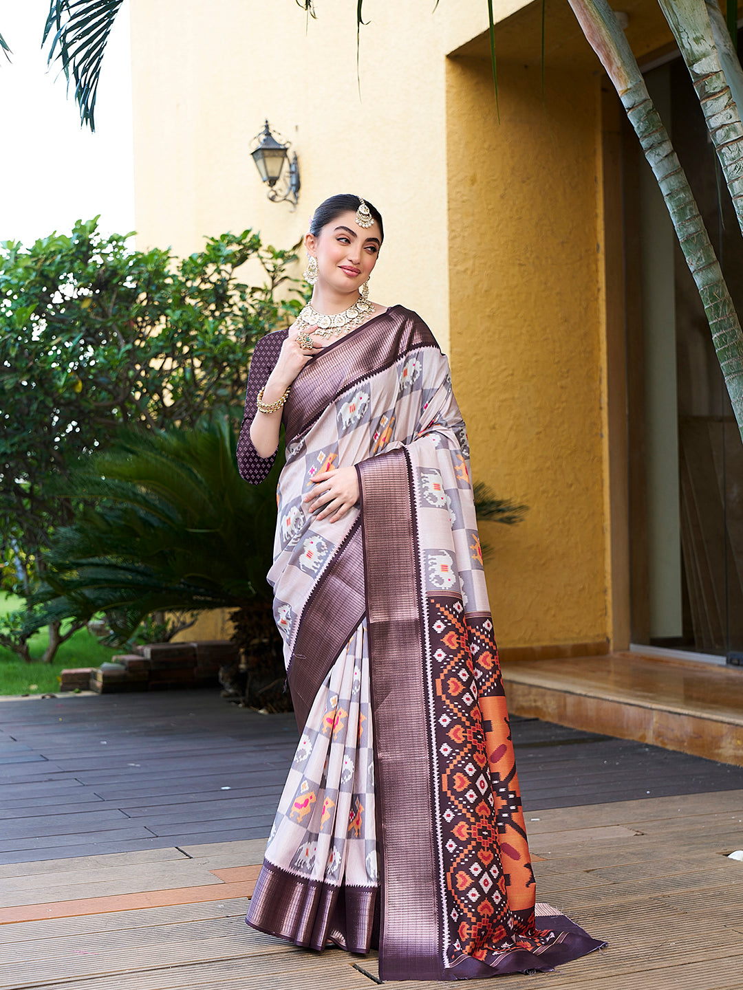 Off White Trendy Crepe Saree With Woven Zari Patta And Designer Print Work
