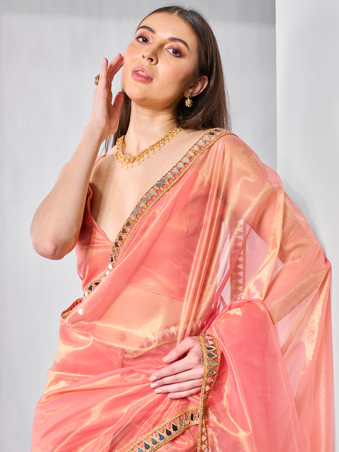 Orange Gold Tissue Net Solid Texture Saree With Graceful Gold Cotted