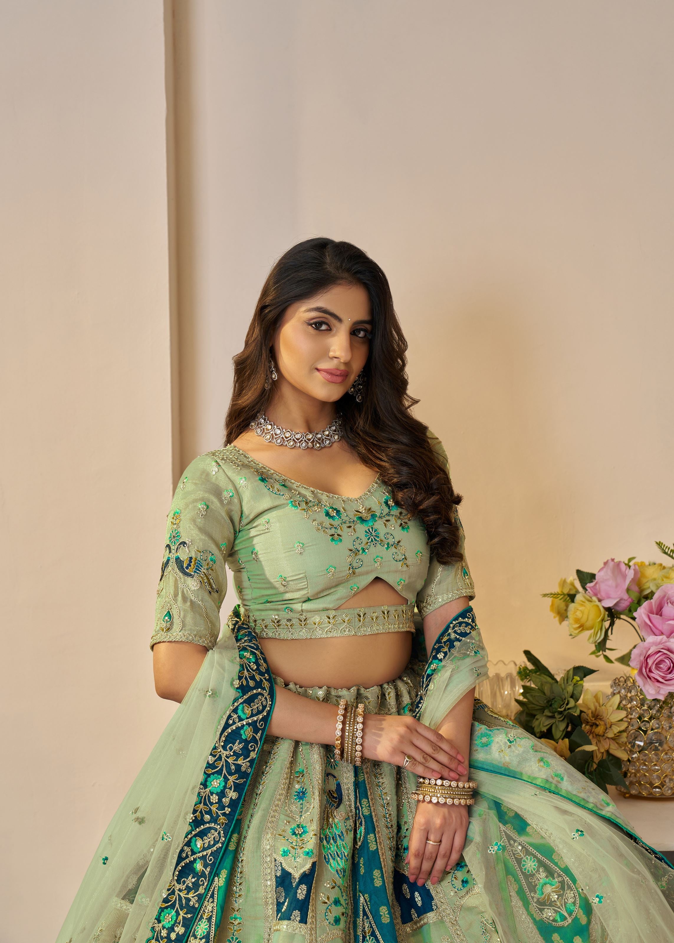 The Rajsi Haathi Collection: Graceful Green With  Peacock Embroidered Bridal Lehenga
