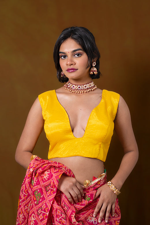 Yellow Sleeveless Blouse in Art Silk with A Plunging Geometric Neckline